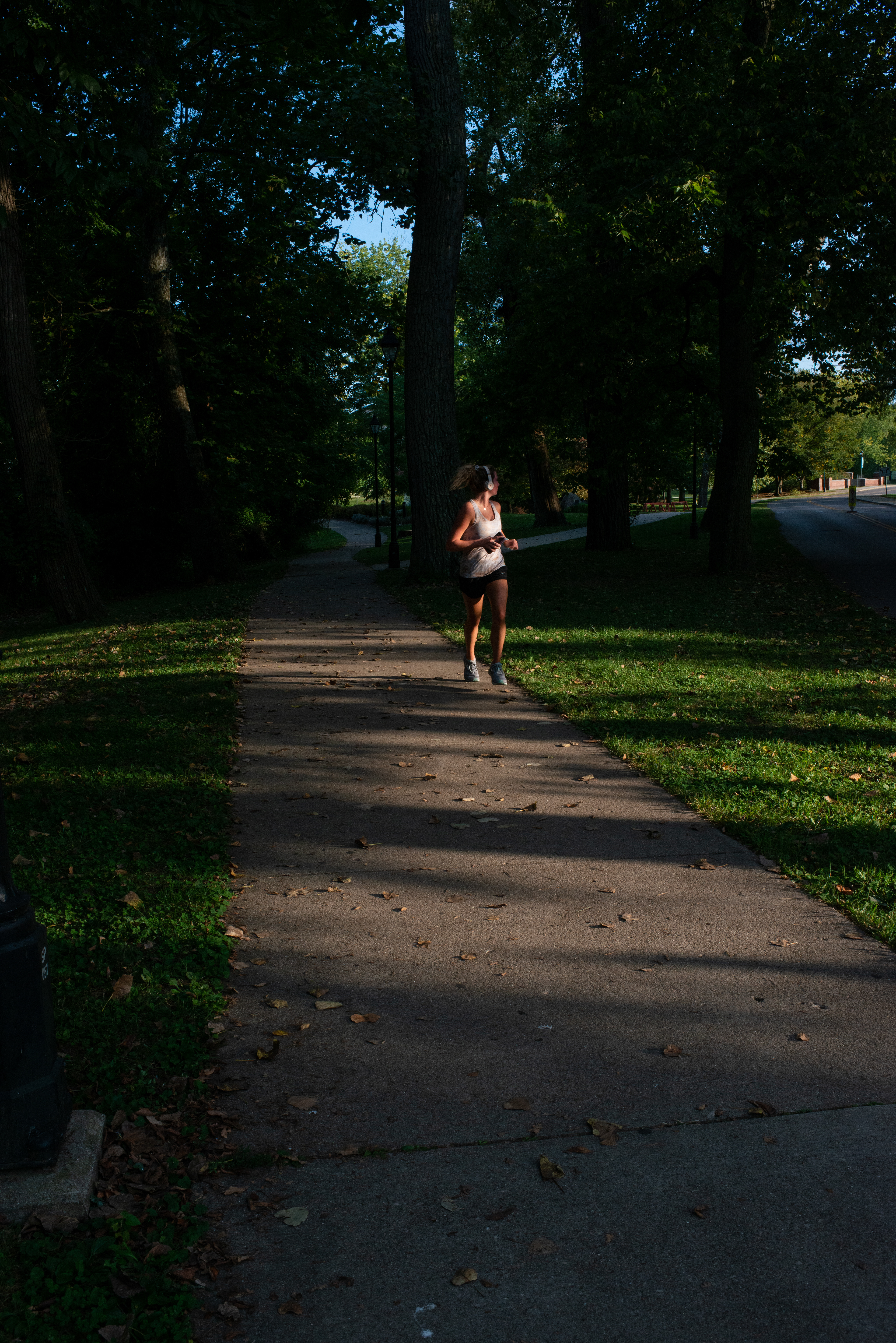 An Ohio University student turns her head to look behind her while running on the Athens campus on Sept. 26, 2020.