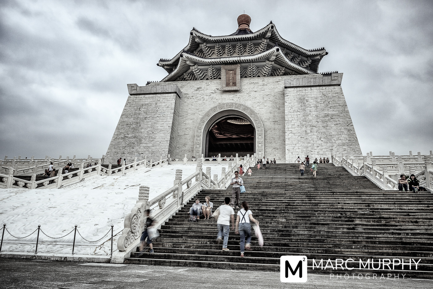 De-Saturated National Chiang Kai-shek Memorial Hall in the Zhongzheng District of Taipei Taiwan from a Low Perspective with Visitors on the Stairs