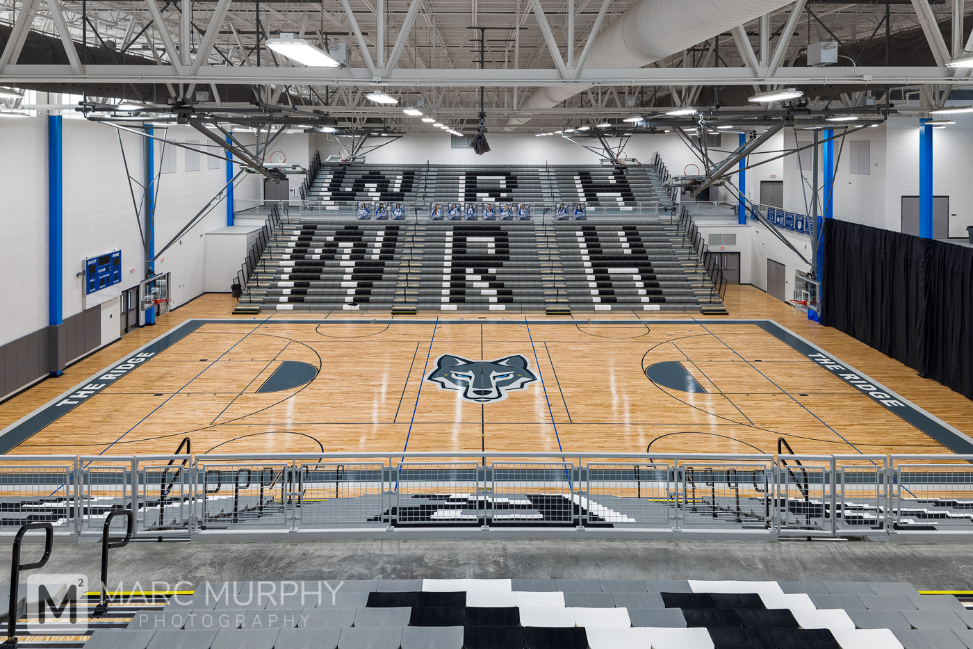 West Ridge High School Gym with lights, bleachers and basketball court