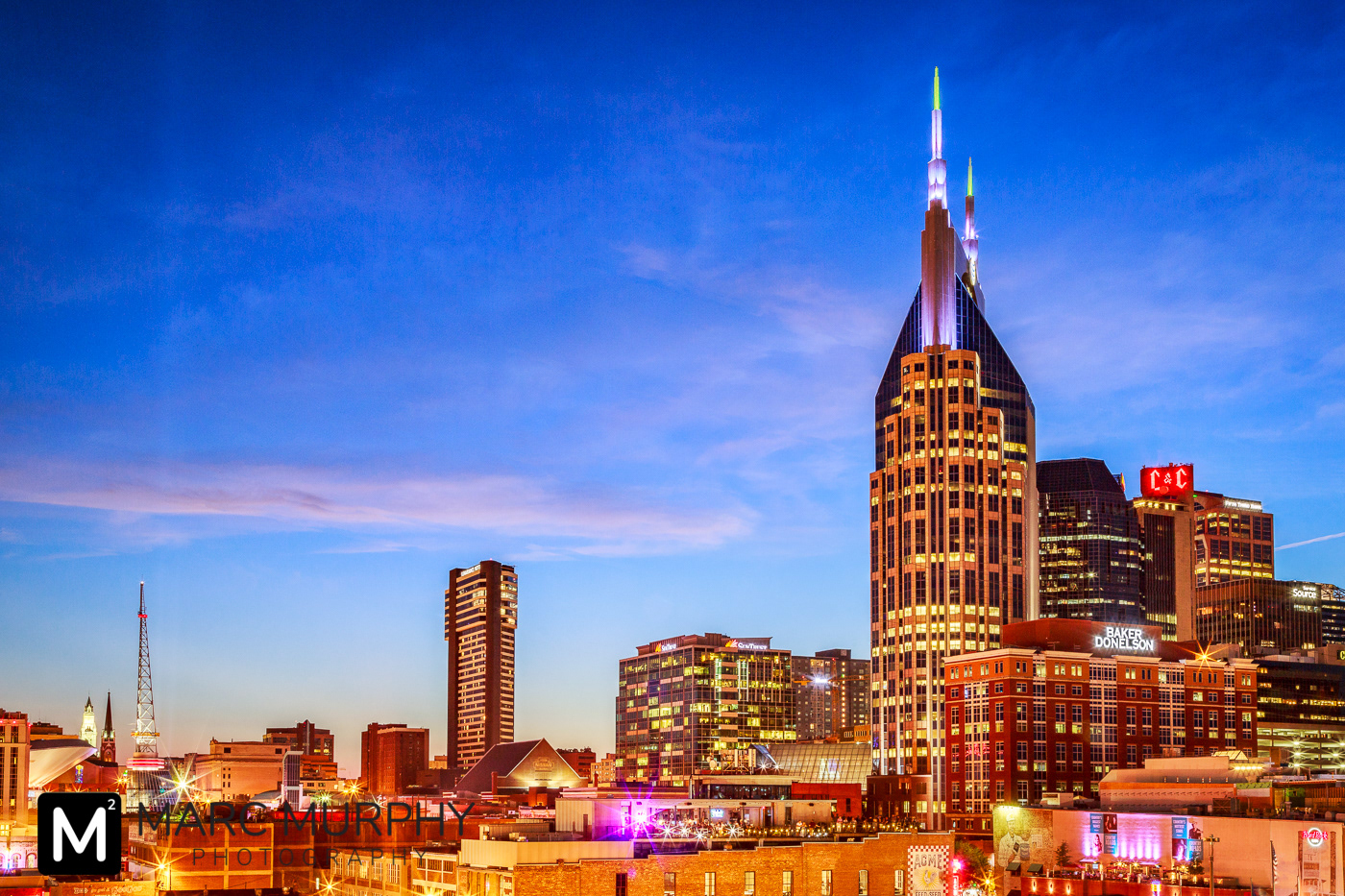 Downtown Nashville Tennessee Skyline at Sunset with Sunbursts Lights and Blue, Pink, Purple, Orange and Yellow Sky
