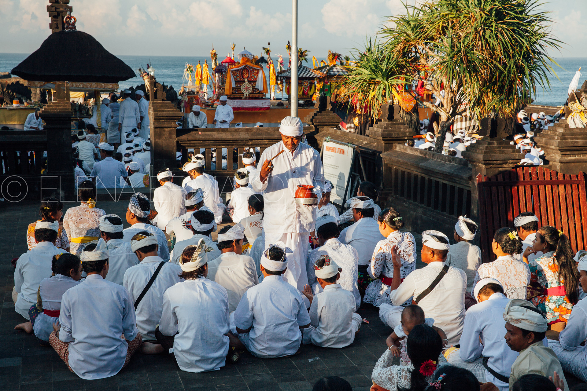 Balinese people take blessings in the temple during religious ceremony commemorated to Nyepi celebrations, Bali, Indonesia.