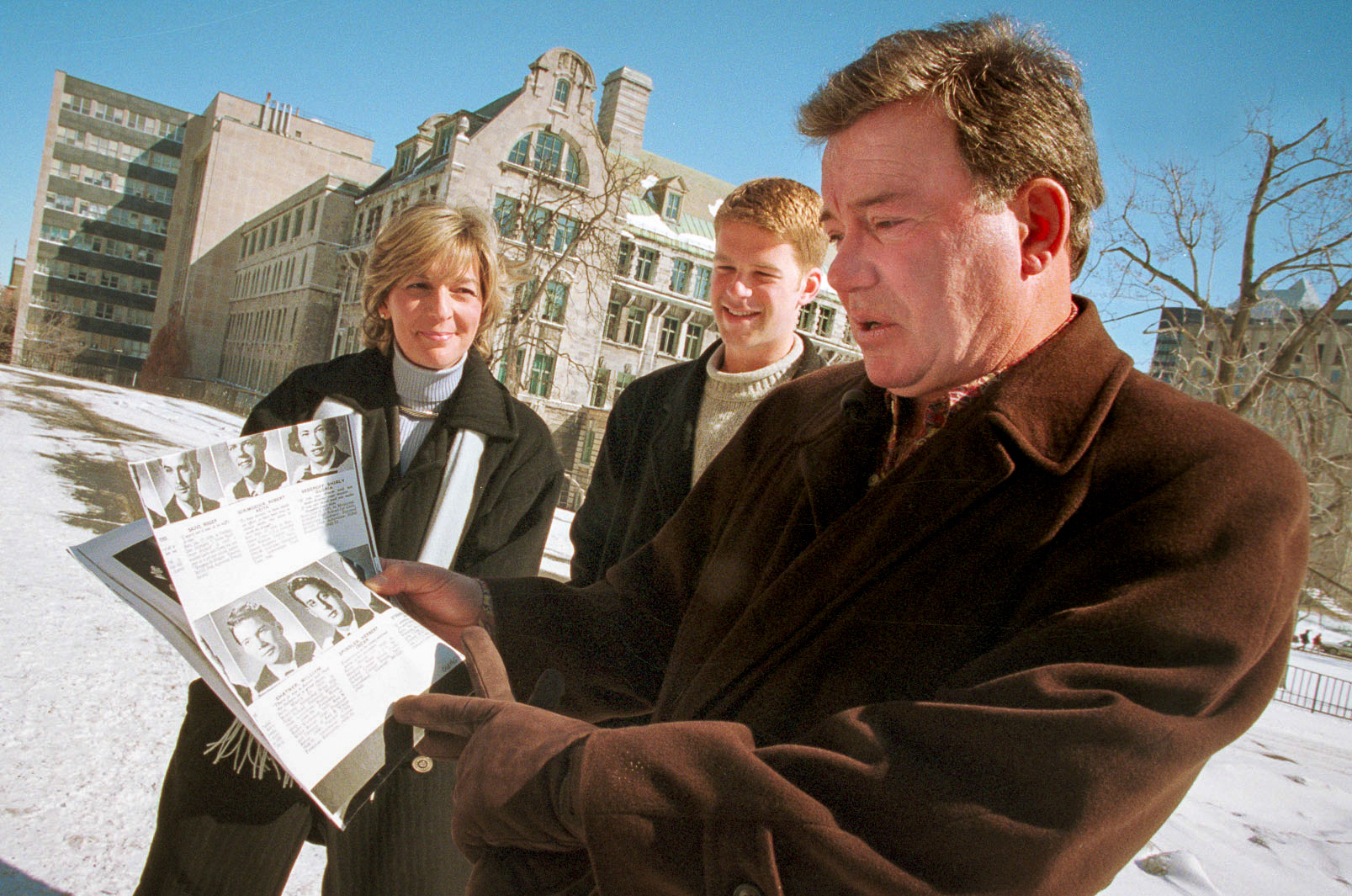 While visiting the campus for the first time since he graduated in 1952 , William Shatner was shown his yearbook photo by Dean of Students Rosalie Jukier.  March 1999.