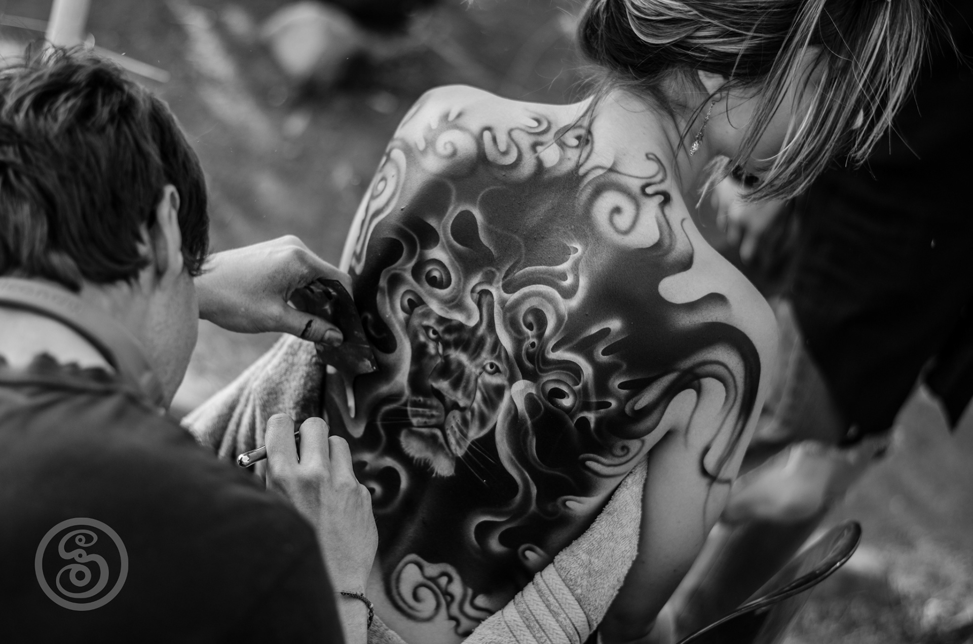into the cages lion body art black and white
