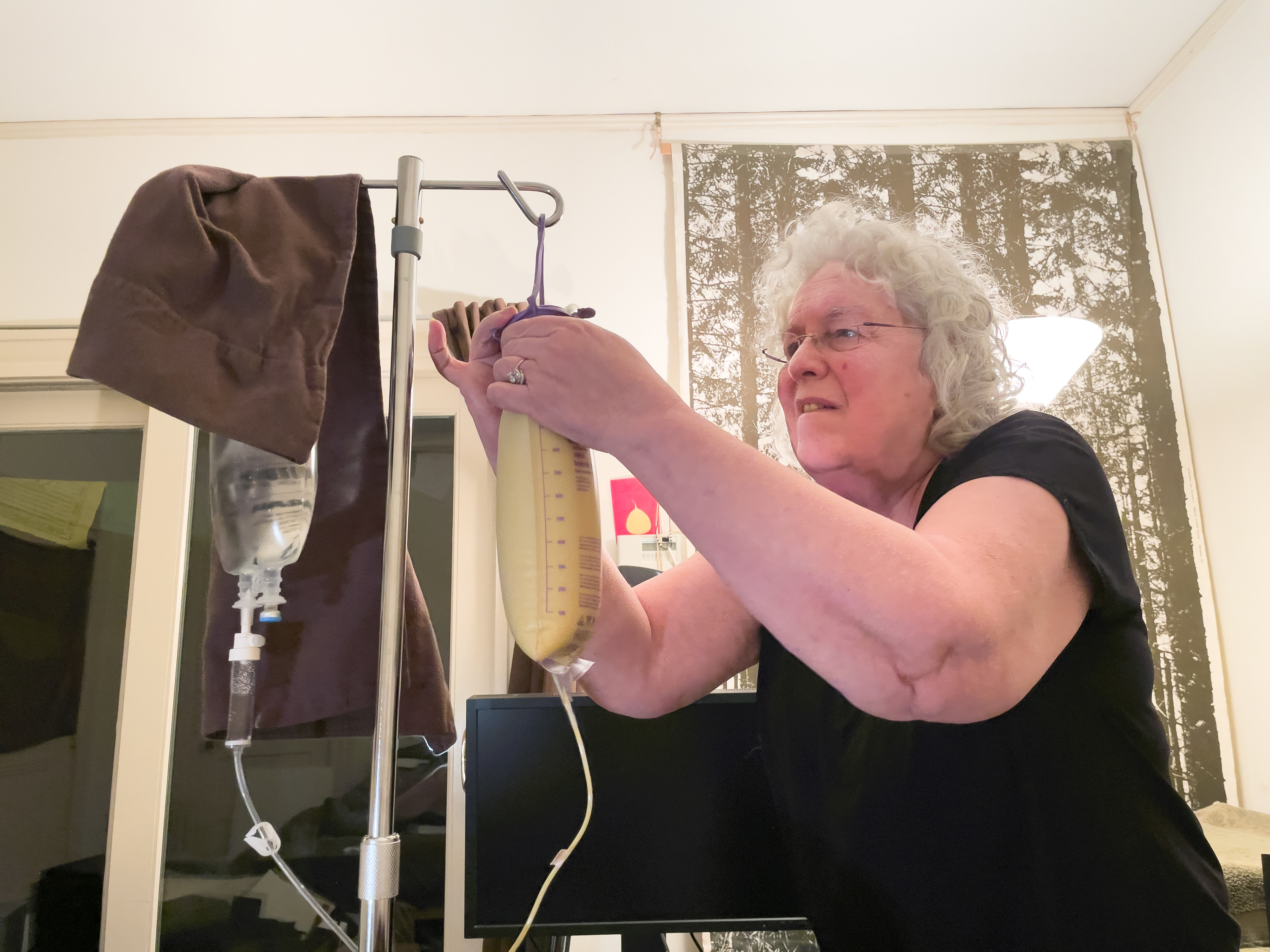 My mother filling my food bag.