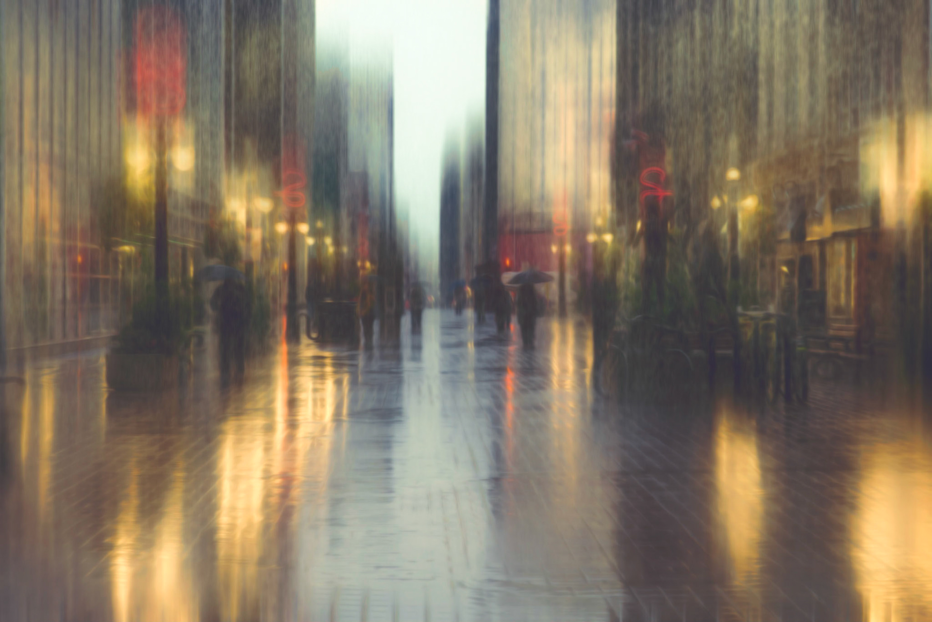 Sparks Street Ottawa. Pedestrians walking in the rain at dusk.