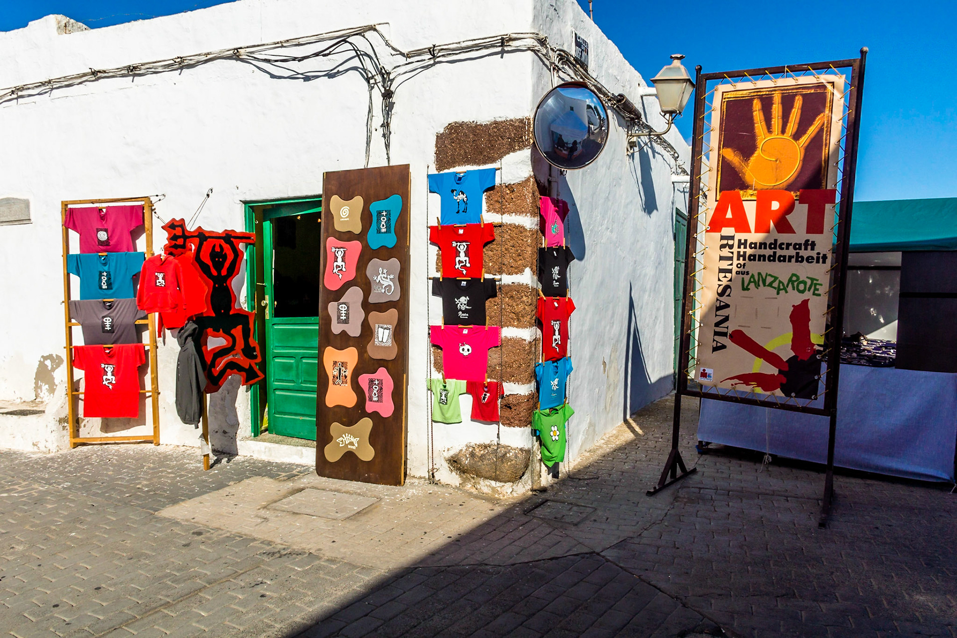 Colourful Timanfaya souvenir shirts, TEguise market, Lanzarote