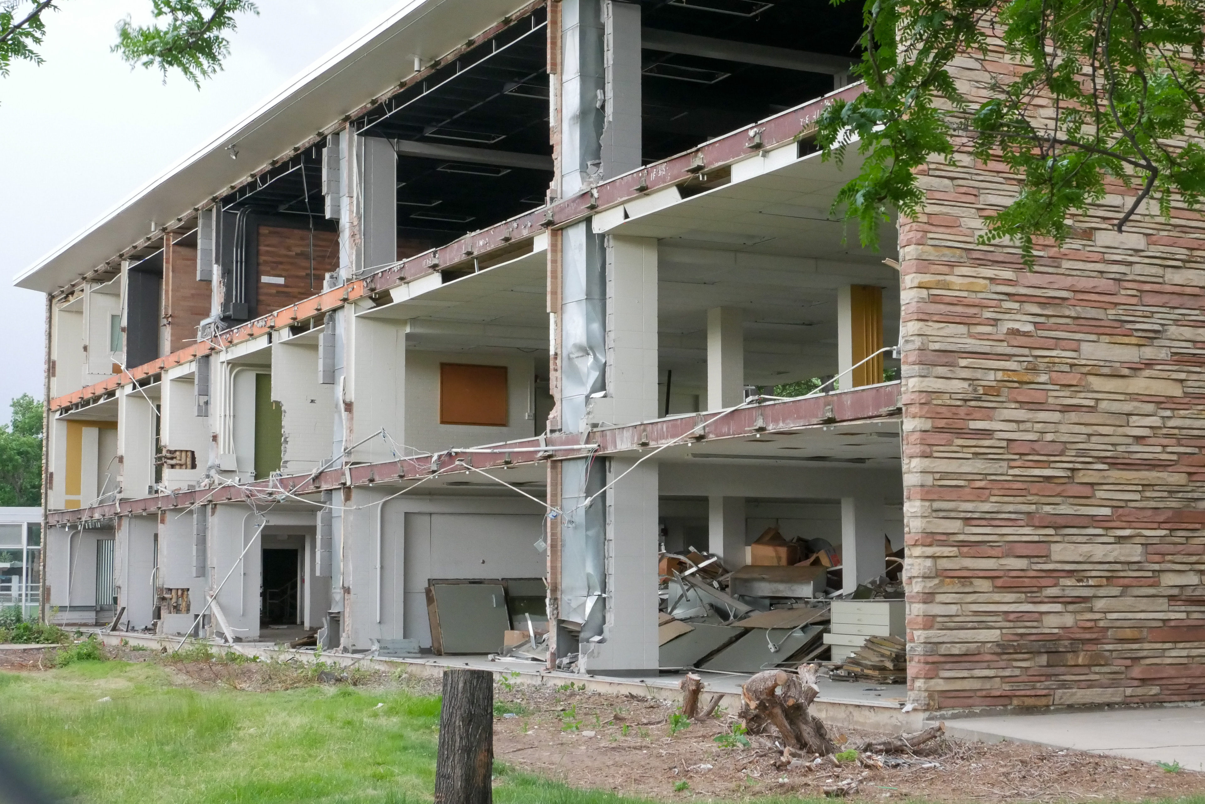 Full removal of windows and sage green panels, north-facing side of the SW wing