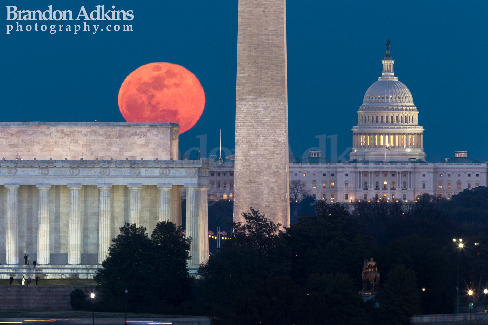 Fine art photograph of moon rising over Lincoln Memorial, Washington Monument, Capitol Building, with blue sky in Washington, DC, District of Columbia