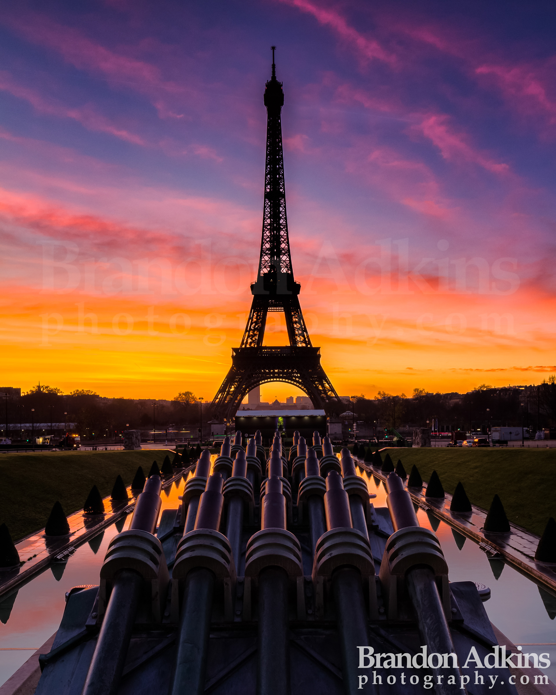 Fine art photograph of Gardens of the Trocadero with shadow of Eiffel Tower in the distance during a beautiful sunris