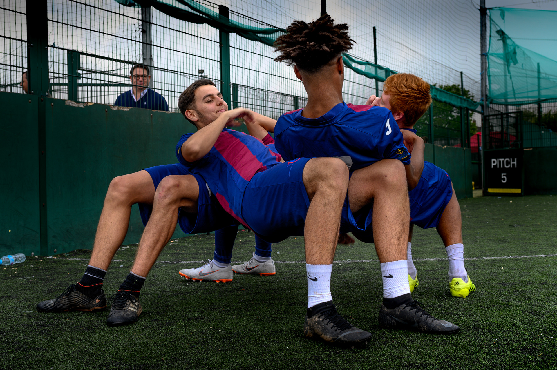 Training at Street Football Wales' football match days brings players a sense of community, of common goals and of a shared experience where discipline, hard work and a focus on good health fosters a belief that the impossible is possible with support from each other. Ex pro football player Leigh Hinds showed up to offer his support and watches on in the background as these players struggle to support each other for as long as possible in the Newport training grounds UK, 1st May 2019 .