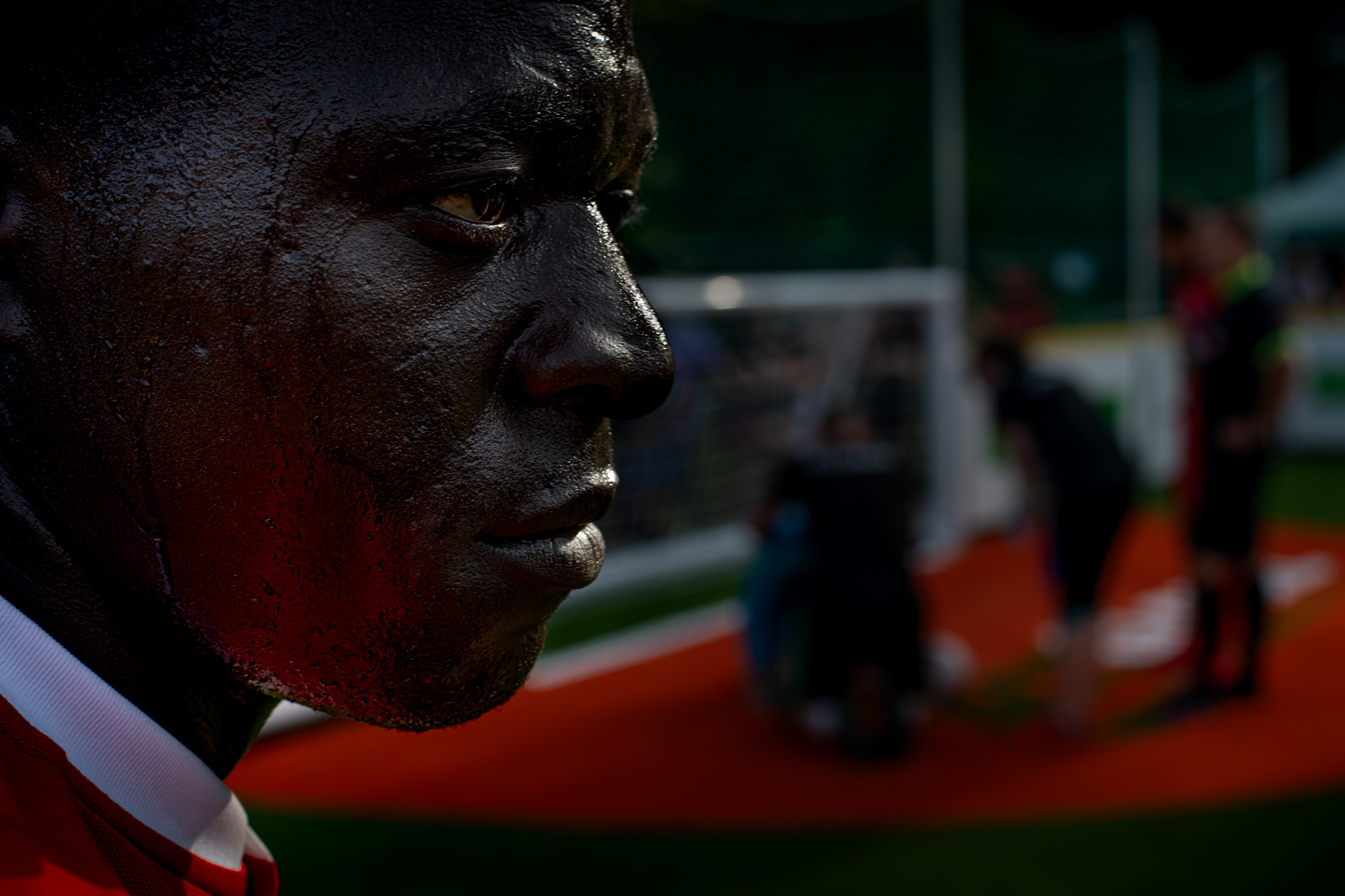Makumbi rests and takes stock momentarily while his goal keeper, Mark, gets first aid after a heated exchange with the favourites, Mexico, 2nd August 2019, at the Homeless Football World Cup tournament in Cardiff, UK, 2019.