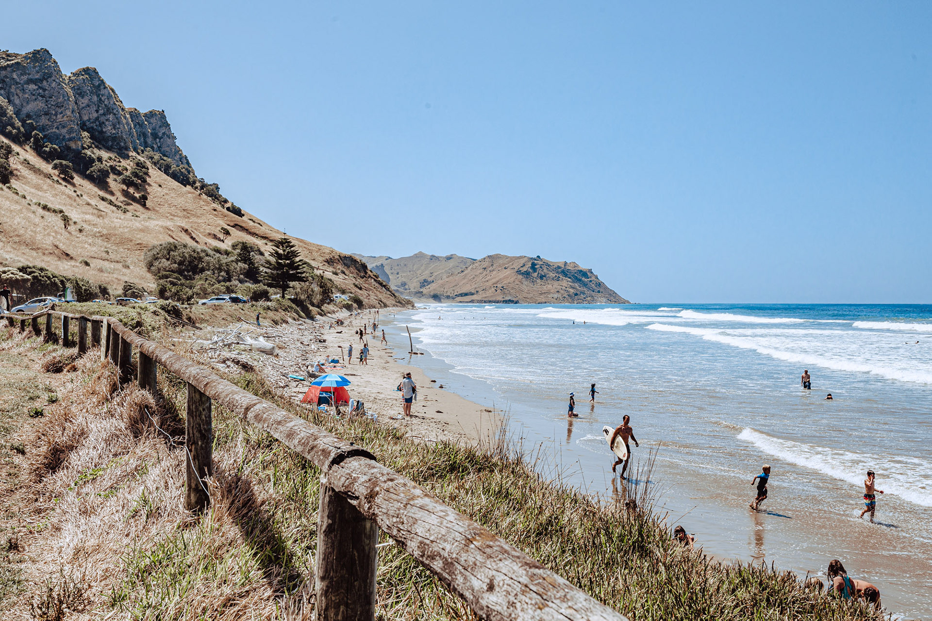 Swimmers enjoying Kairakau beach in the summer time