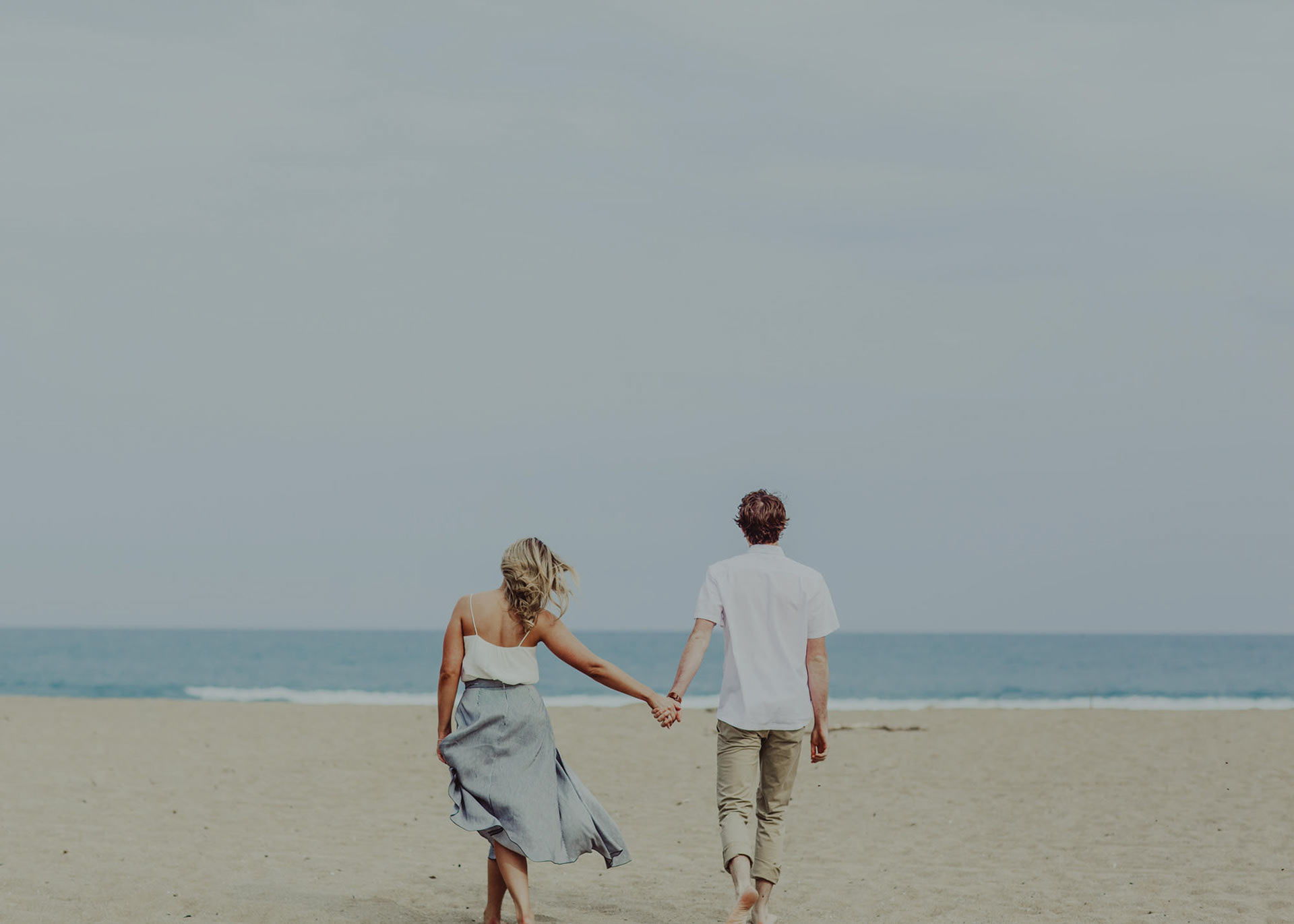 A couple walking on Waipatiki Beach