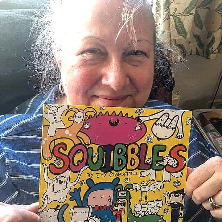 Squibbler with a copy of Squibbles