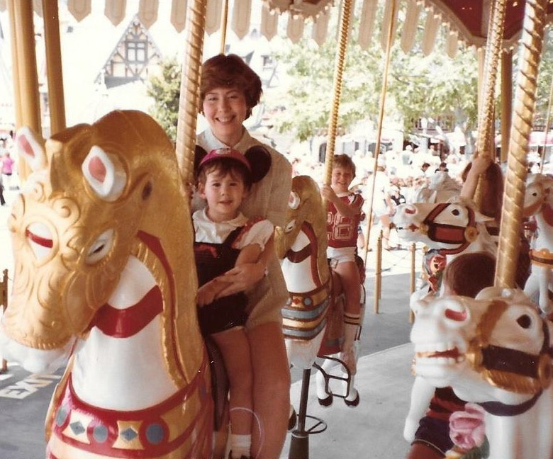 Kristy with her mom on a carousel. Copyright 2020 Kristy Boyd