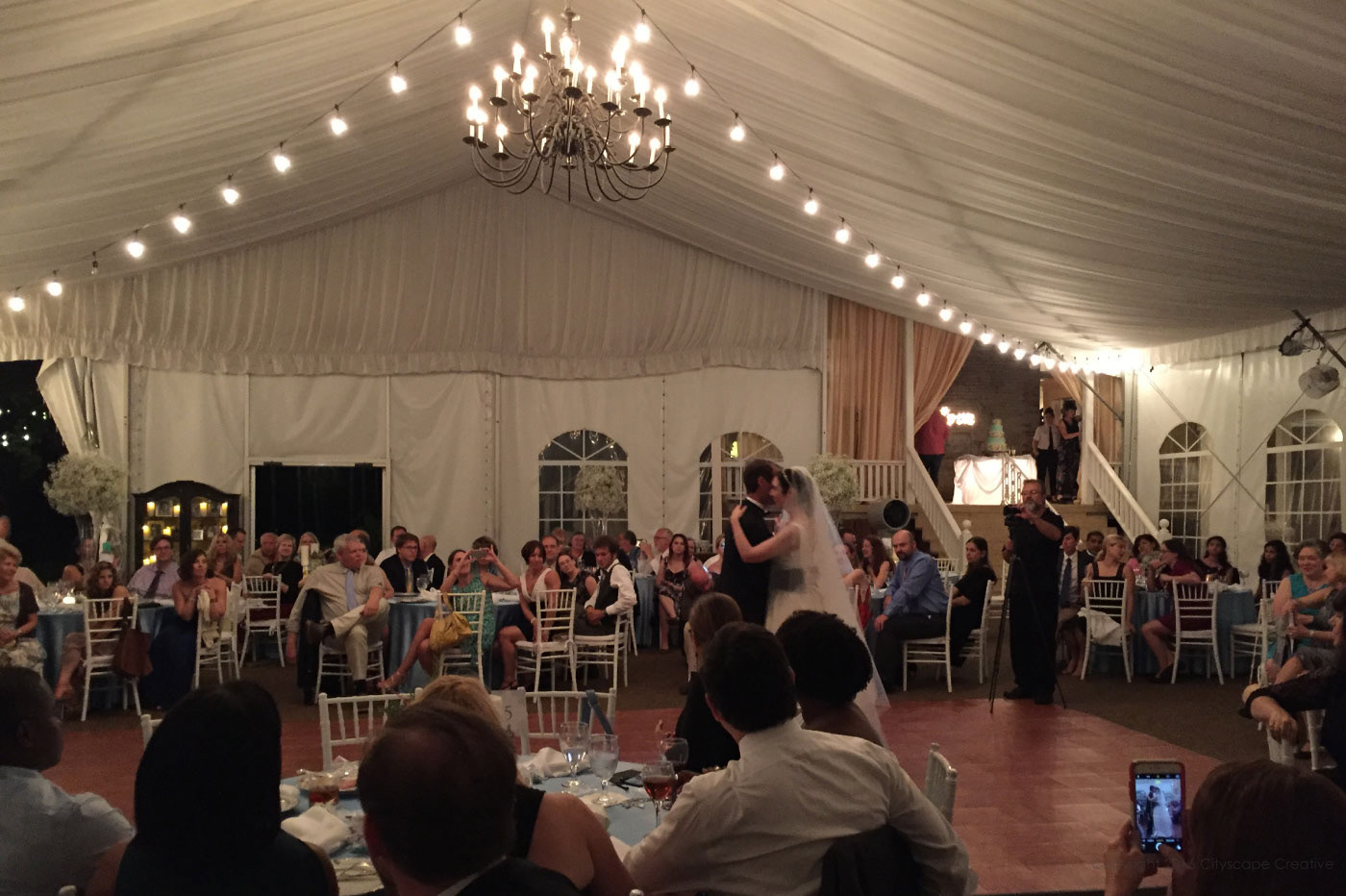 Reception at Riverwood Mansion with dinner and dancing under tent with Gleaming Chandelier and strung lights Copyright 2016-2018 Dr. Mary Kay Bartek
