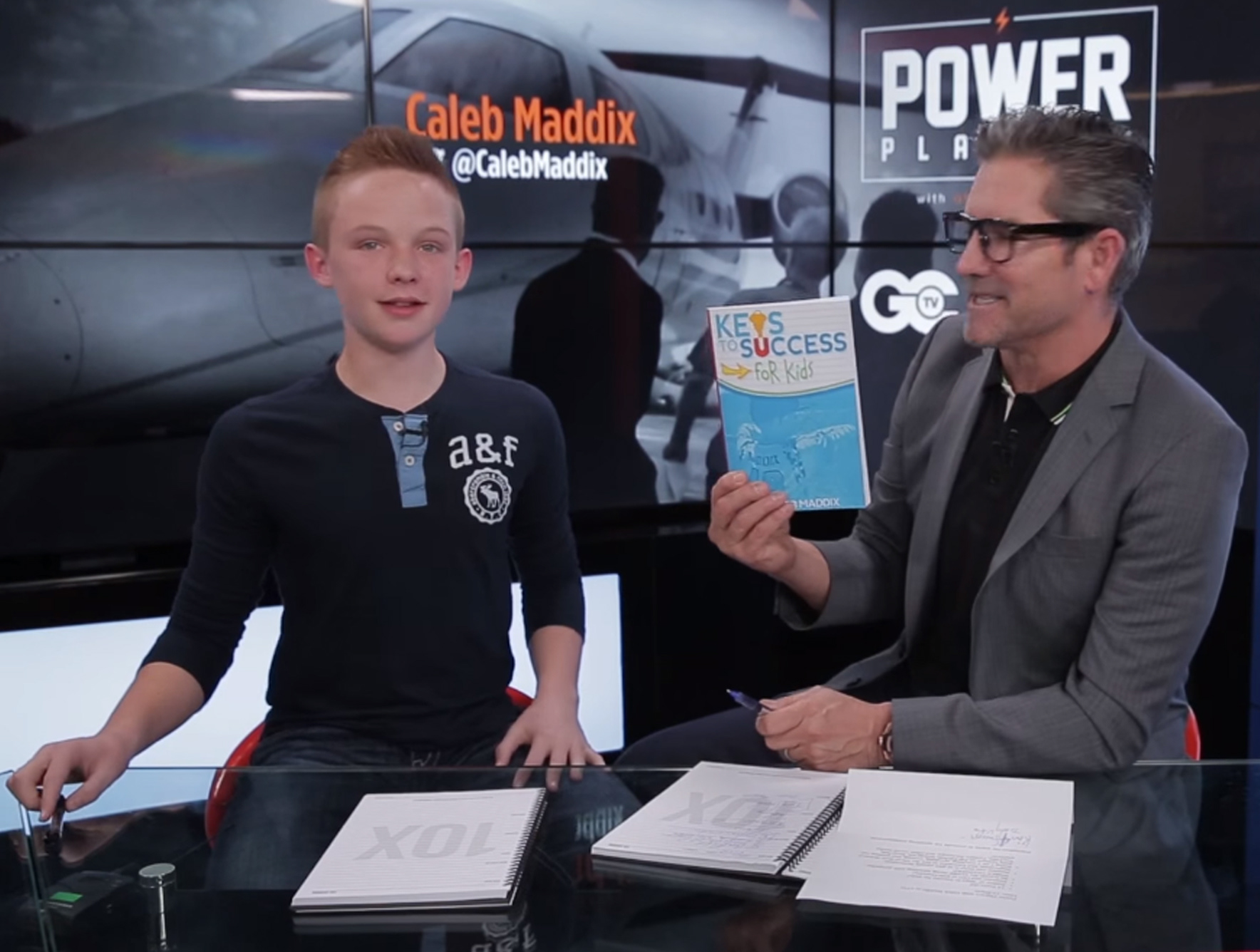 Grant Cardone with Caleb's book- I designed the cover