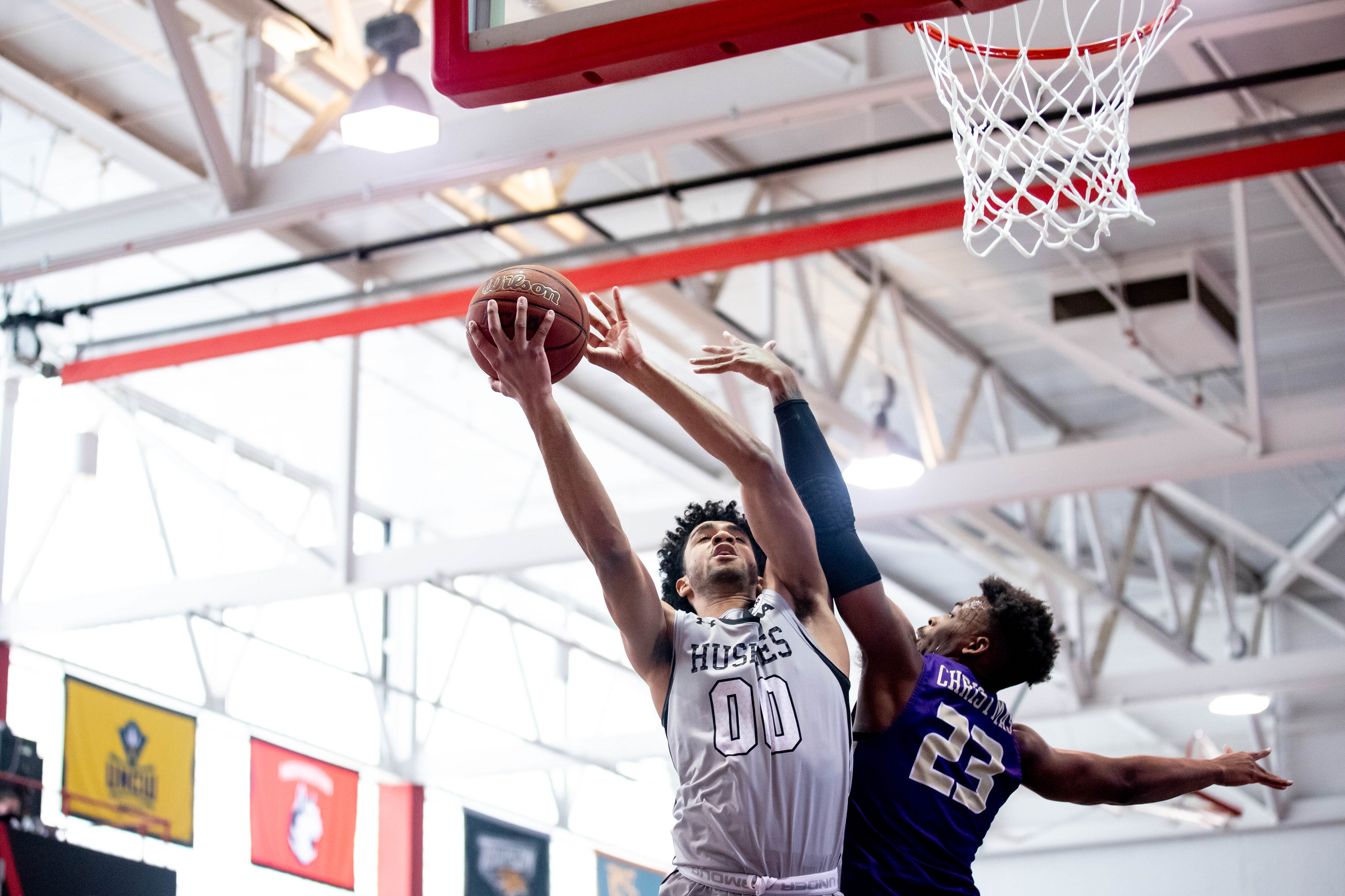 Northeastern forward Jason Strong scores against James Madison University January 24, 2021.