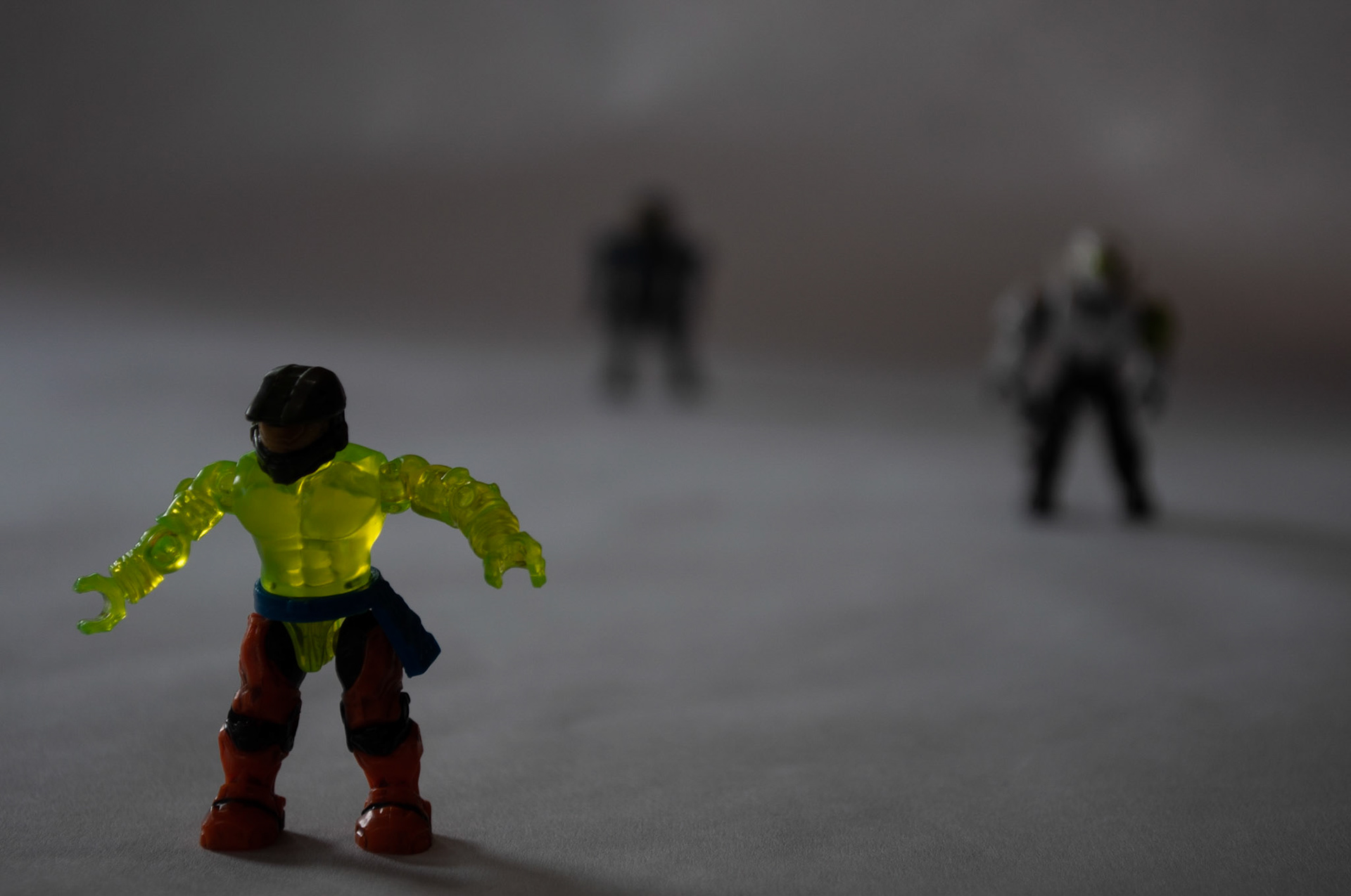 Foreground Focus 2: Lime Figure, Focusing on the foreground figure in 1/10 F16, 20200925, Kitchen table, Miller, Out of the 5 foreground focus pictures I took this one had the detail and focus of the fore figure, but lacked the lighting I wanted. The middle and background figure were less blurred in this shot. Camera Settings: Nikon D500, ISO 100, 55mm, f/5.6, 1/40s