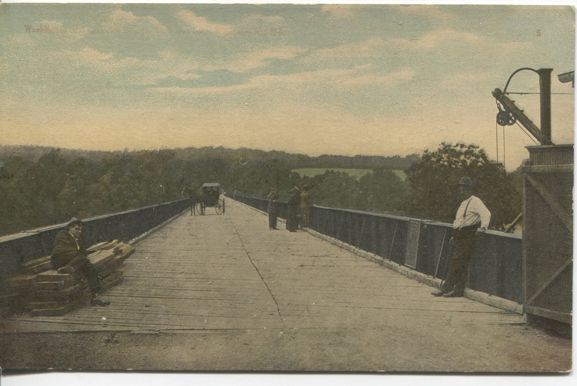 1909 First Toll Collector Hamilton Power. Earl Downs seated on lumber.