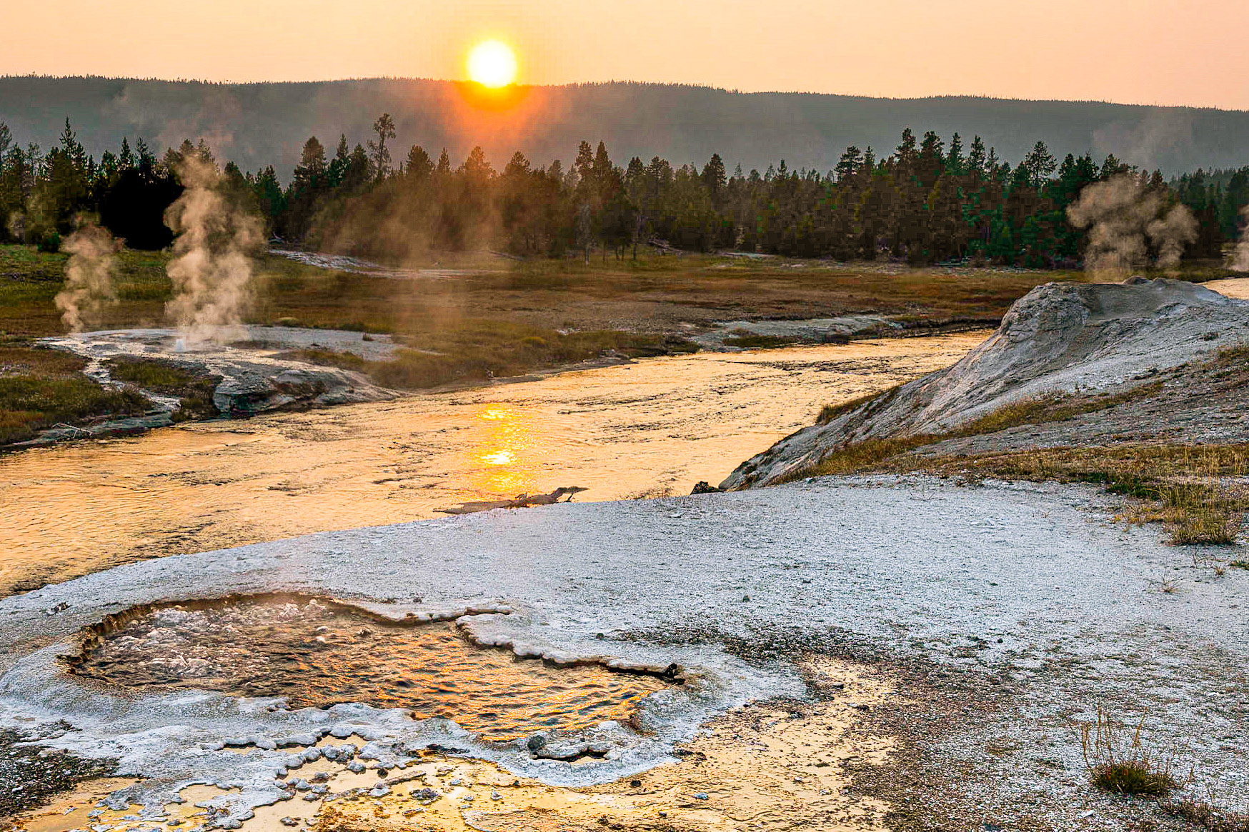 Sunset over Firehole River, Yellowstone National Park.