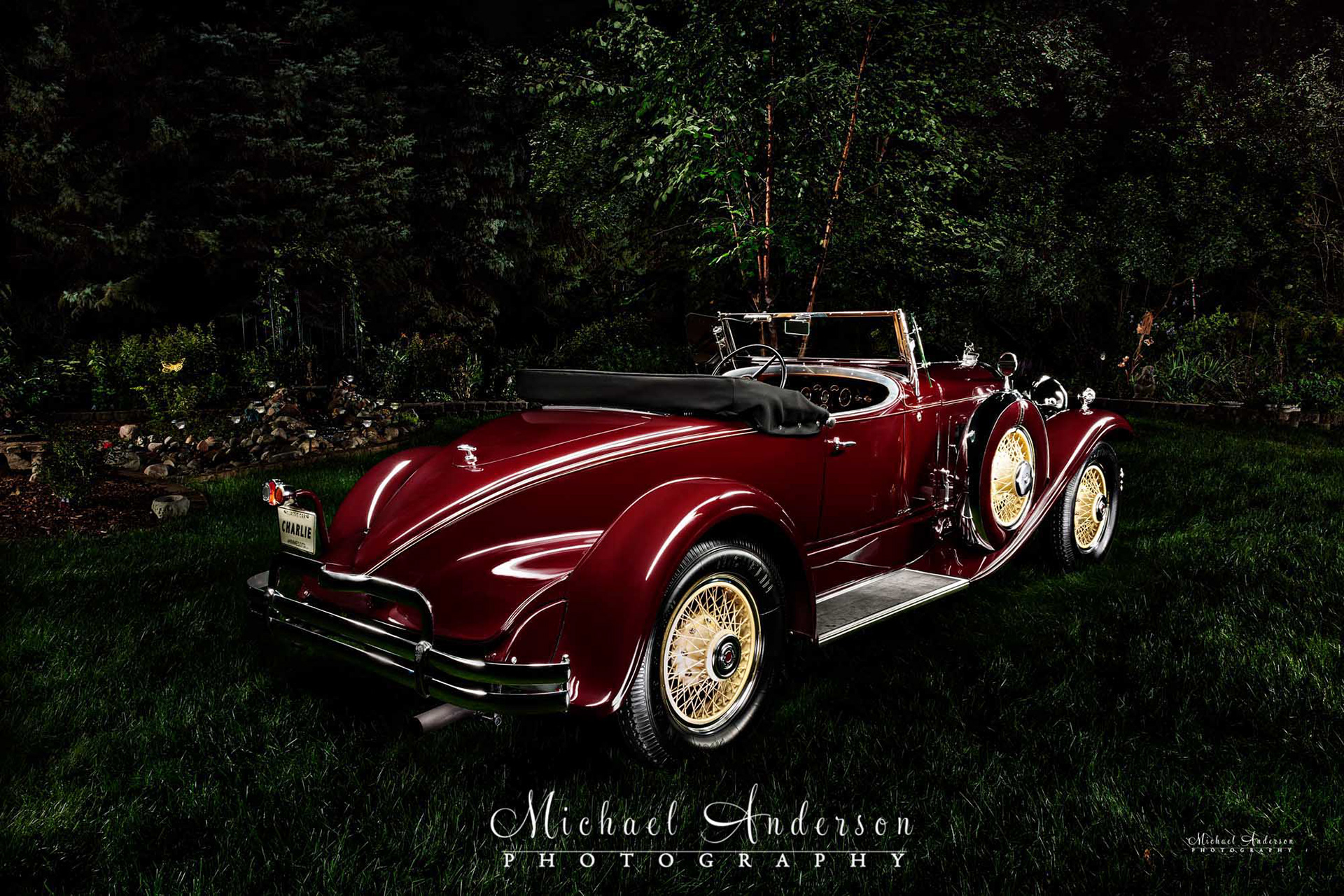 Light painting of a mint condition red 1930 Packard Boattail.