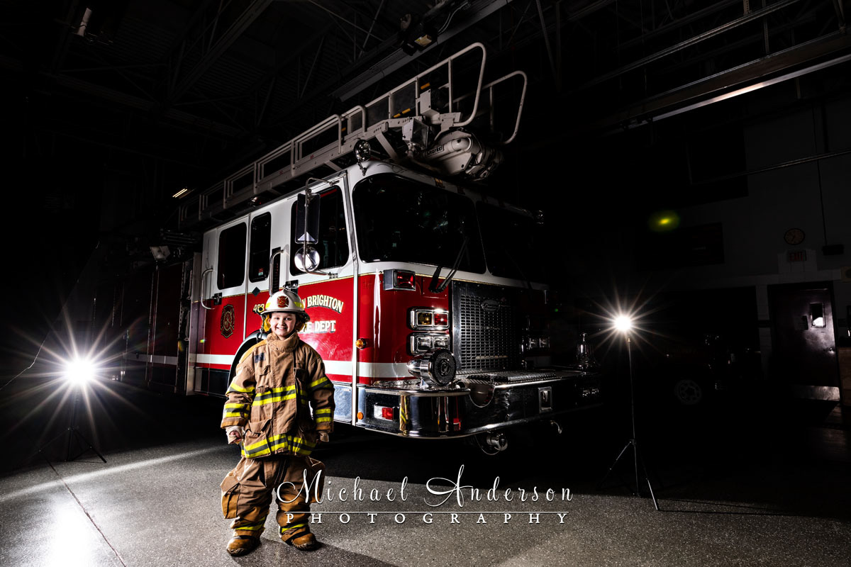 The set-up photo, before light painting, of New Brighton Aerial #498, 1955-CJ-5-Jeep #3, and a junior firefighter.