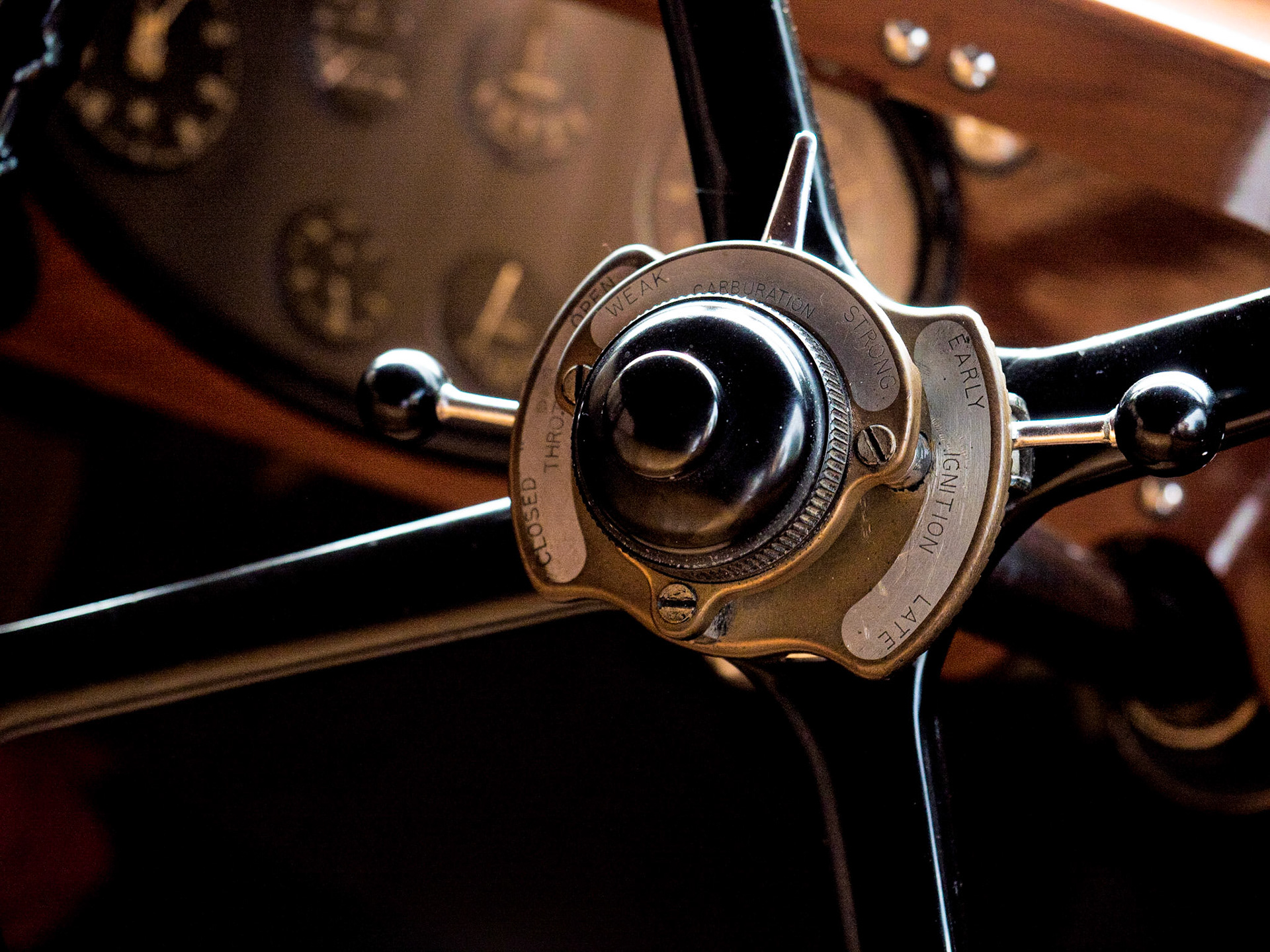 The steering wheel of a 1954 Rolls Royce Silver Dawn. The beauty of craftsmanship is equalled only by the intricate controls. 

To me, this image pays an ode to modernization - its showcases so subtly, how electronics and fly-by-wire wizardry has eased our lives.
I'd have needed a 300 page manual to drive a car like this!

That said, I am forever enchanted by the beauty of the creations of the bygone era - and this is an excellent example of the handiwork of the '50s