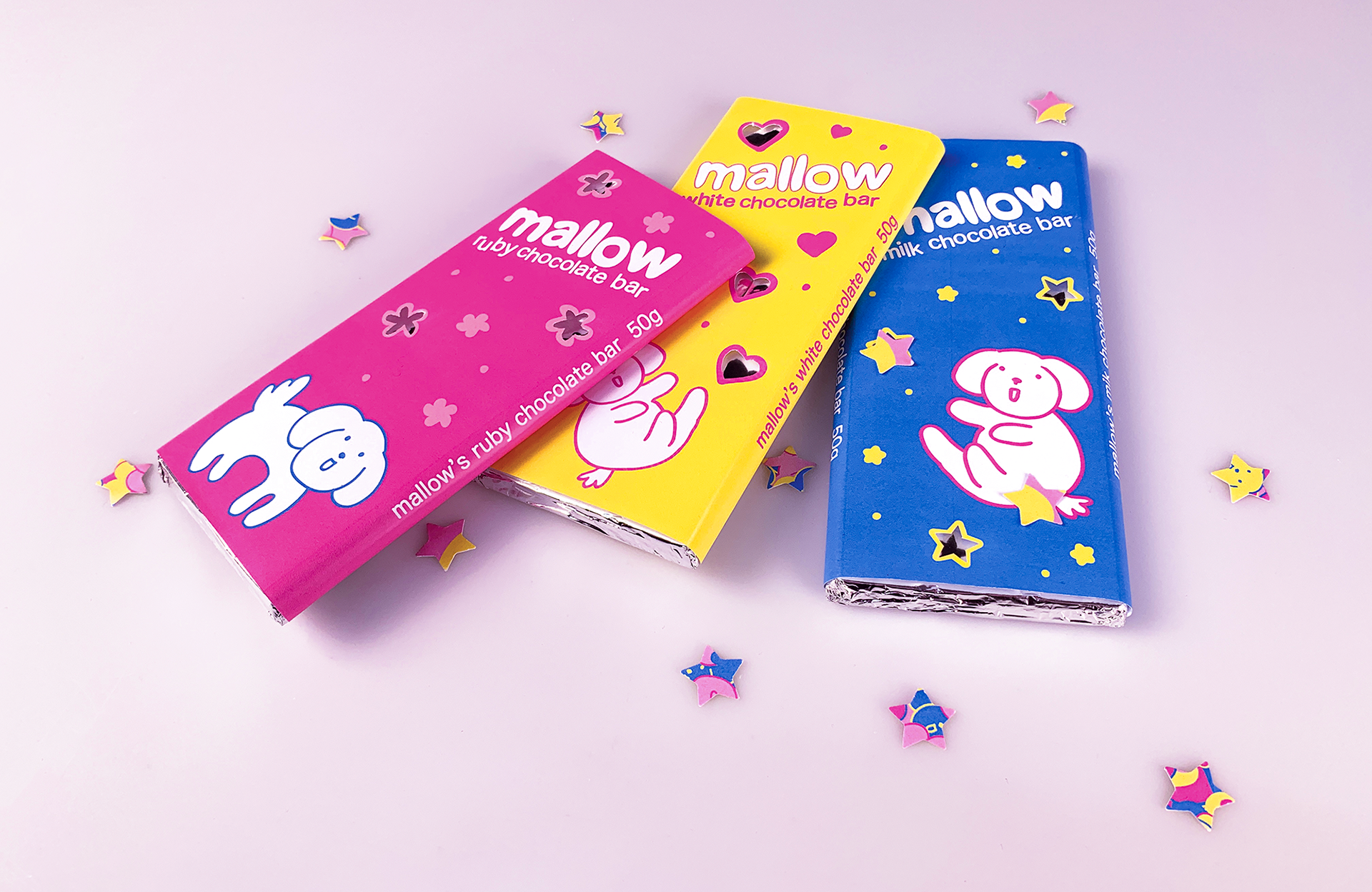 chocolate bar wrappers in bright colours, sprinkled with star confetti.