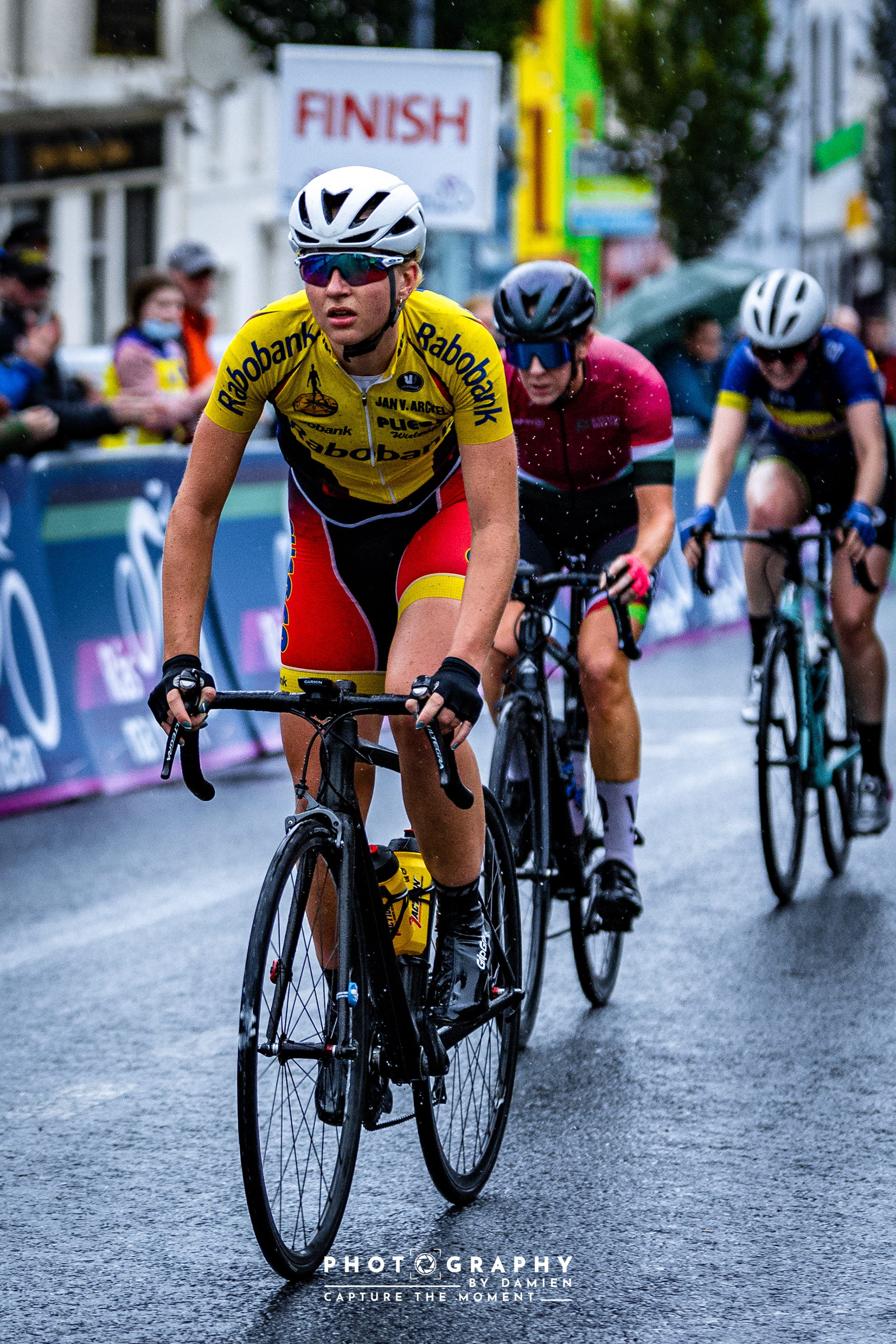 Riders from the rear of the peleton cross the line to begin the final lap. Ras na mBan 2021
