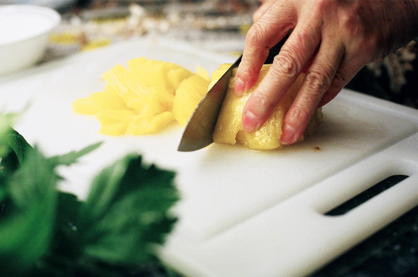 Chopping pinepple.