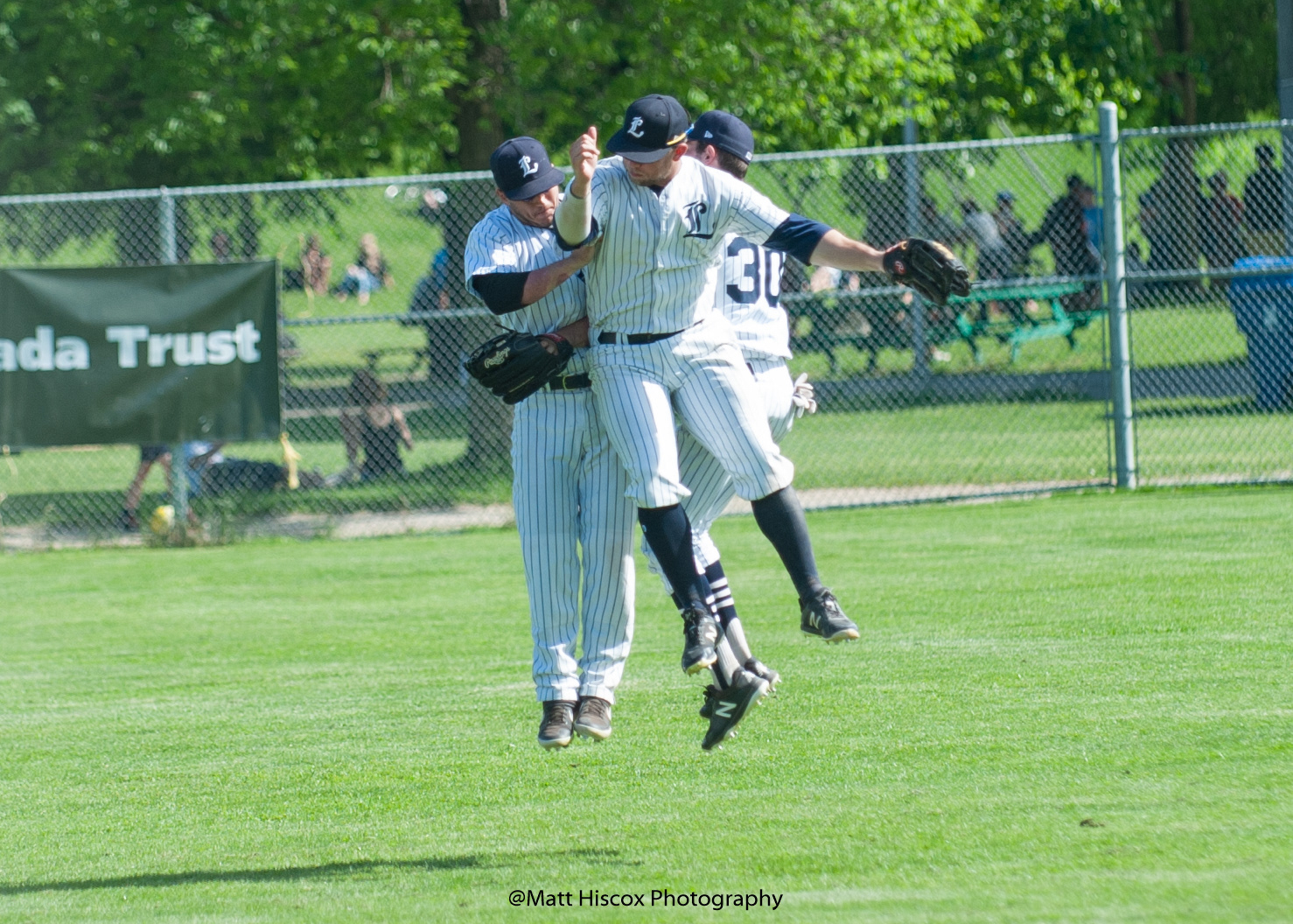 The outfielders celebrate