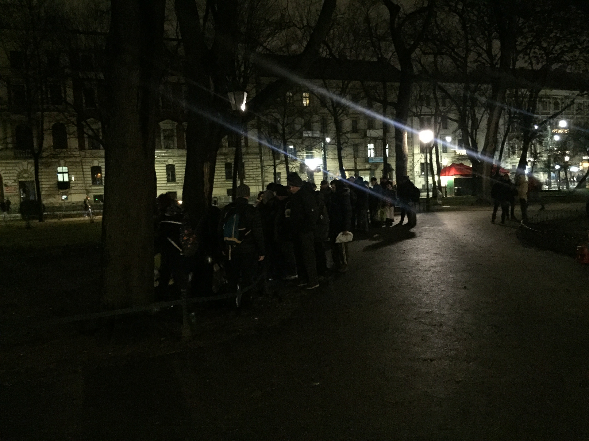 People queueing to get bowl of soup