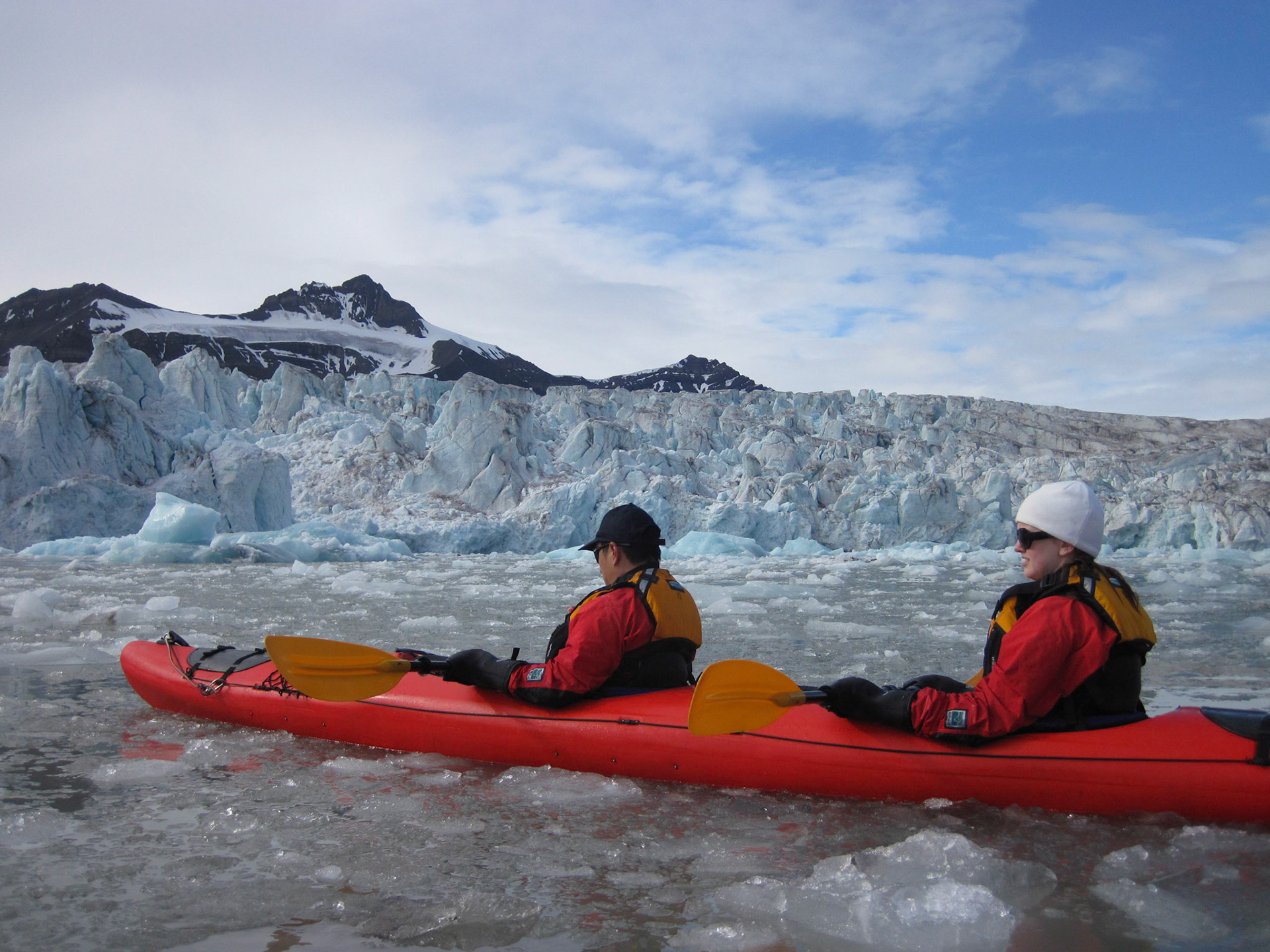 Kayaking close to a glacier