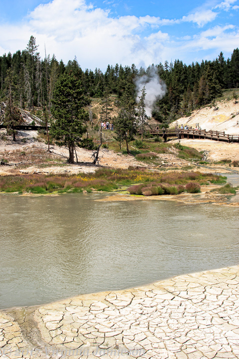 Landscape extremes at Yellowstone NP; dried mud and steaming mists; UA-92916515-1