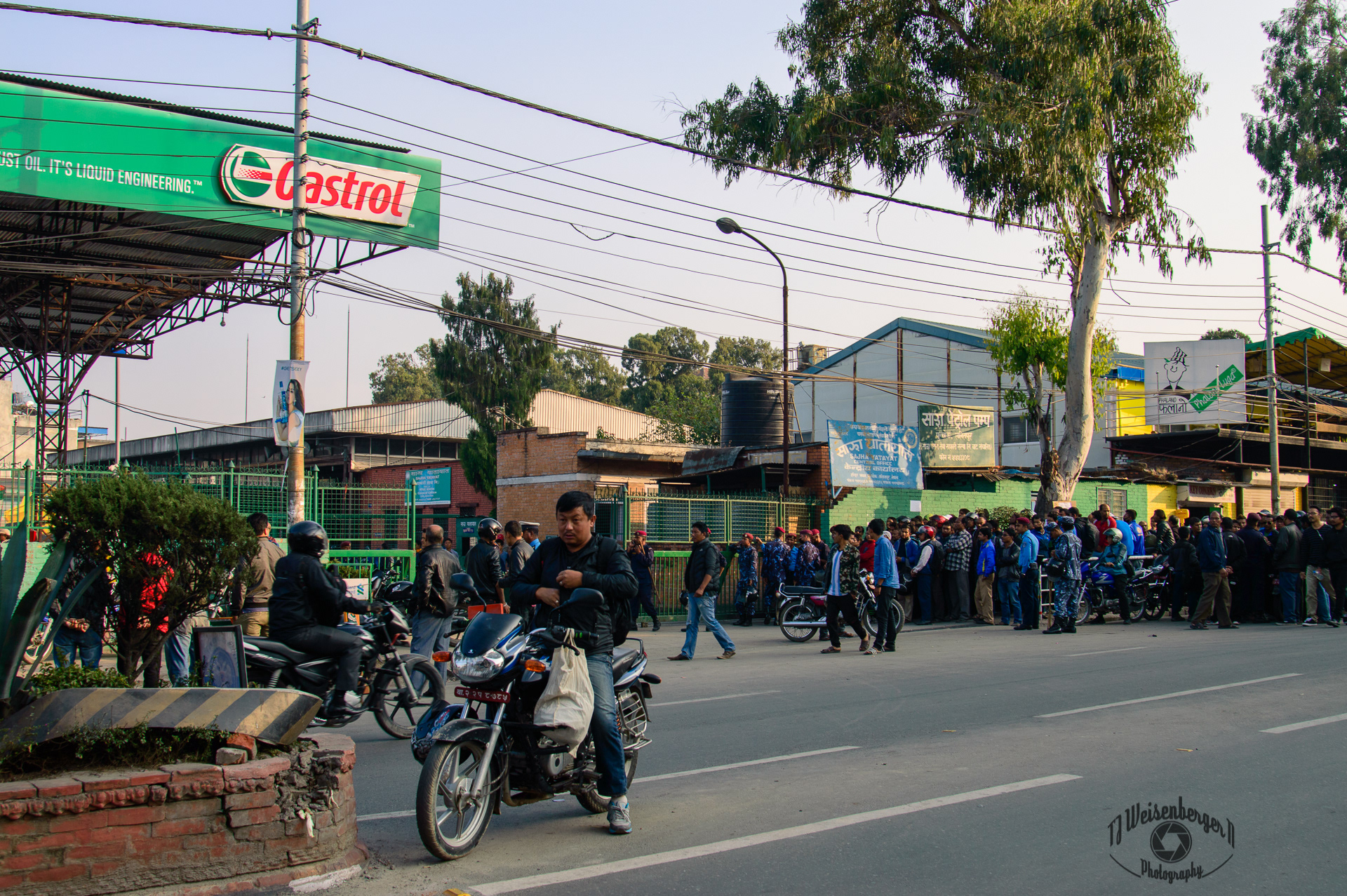 2015 Nepal Blockade - Fuel Shortage, I played cards with some taxi drivers who were on day eight waiting in line and were still far away from the petrol station. - Kathmandu, Nepal; 2015; Border; Border Crisis; Castrol; Crisis; Fuel Crisis; Fuel Shortage; Gas; Kathmandu; Military; Nepal; Nepali; New Constitution; People; Petrol; Photography; Station; Sunny; Tourism; Travel; Travel Destinations; police; street photography; T.J.; TJ; Weiseberger
