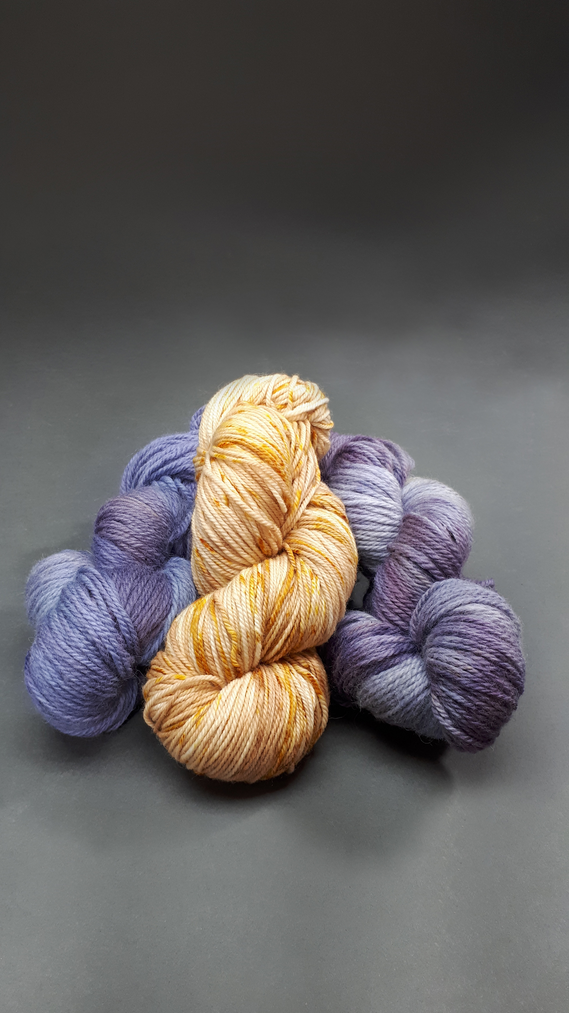 100% wool yarn naturally dyed with wild grapes and red cabbage (purple) and onion skins (yellow)