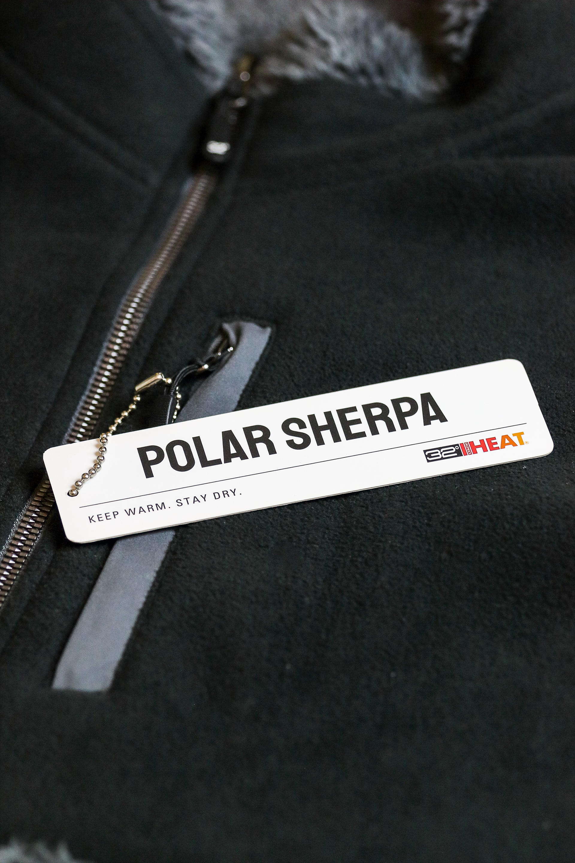 A hangtag that I designed to be mass manufactured; the final print and cutout that would be attached to actual market items is shown.