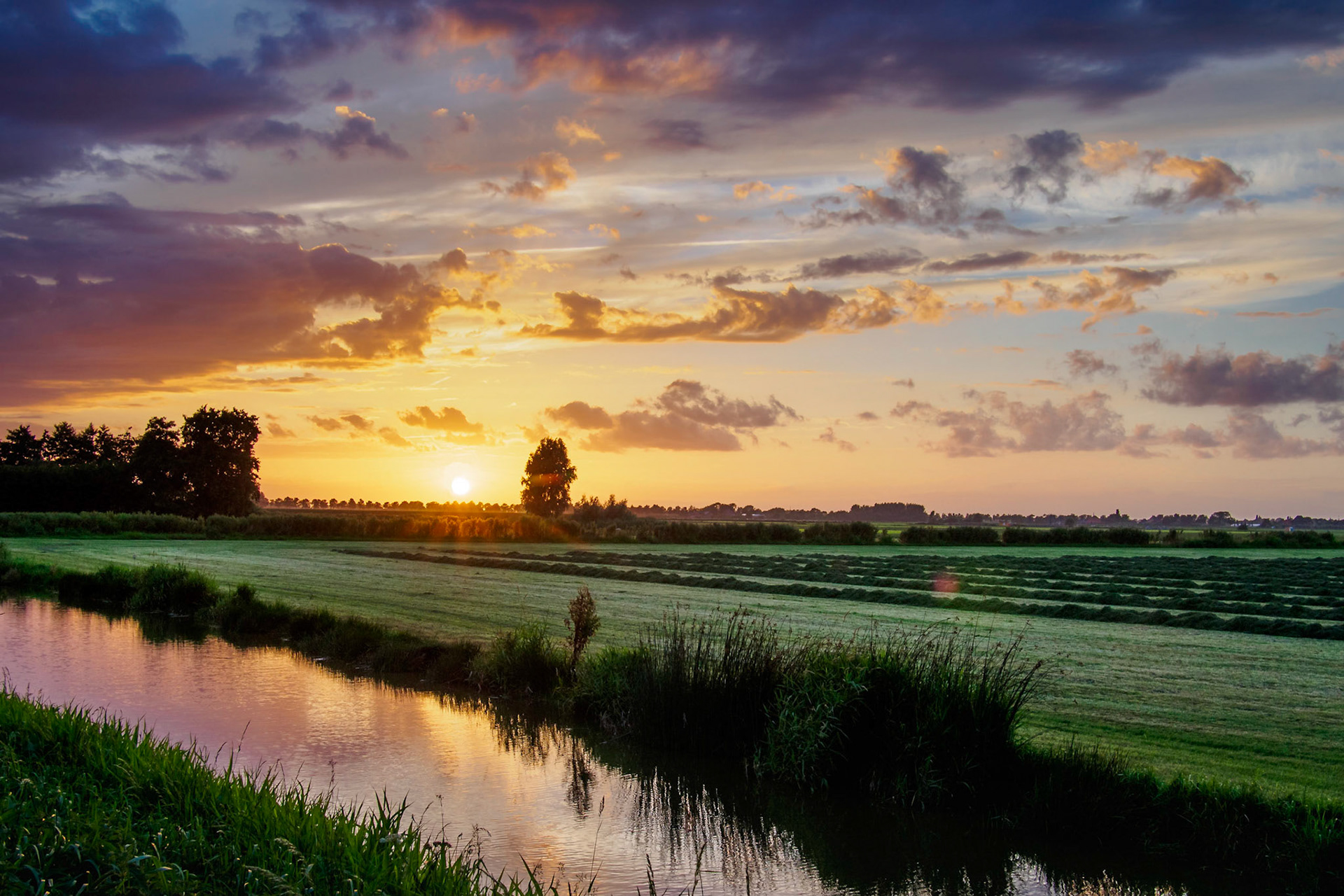 Vivid colored buccolic Sunset over dutch water I