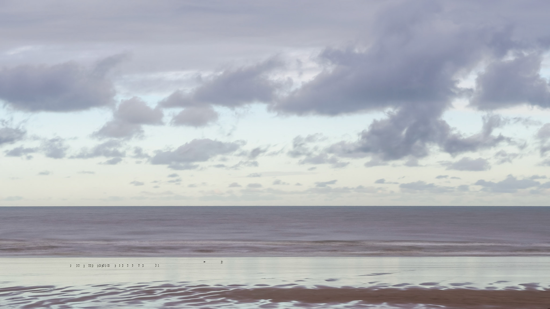 Frozen in time - North Sea under somewhat clouded cold blue sky