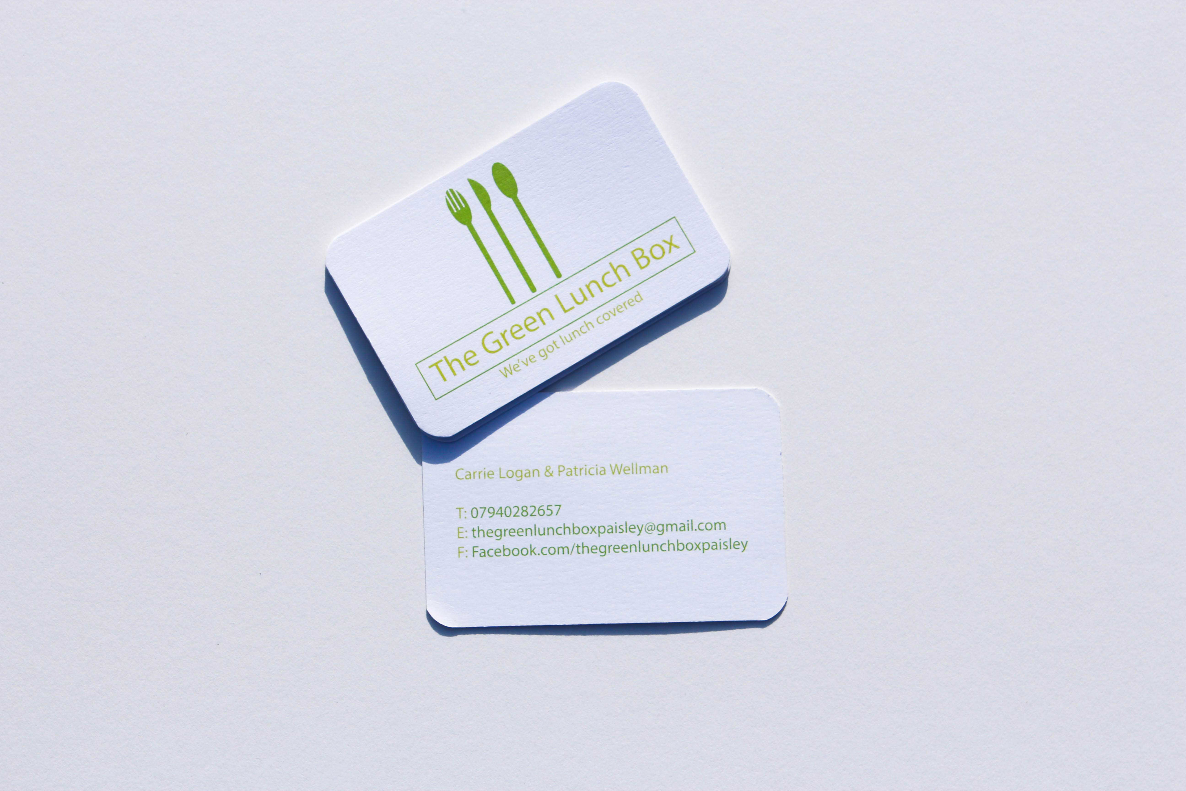 Double sided business card with The Green Lunch Box logo on front, contact details in green on the reverse