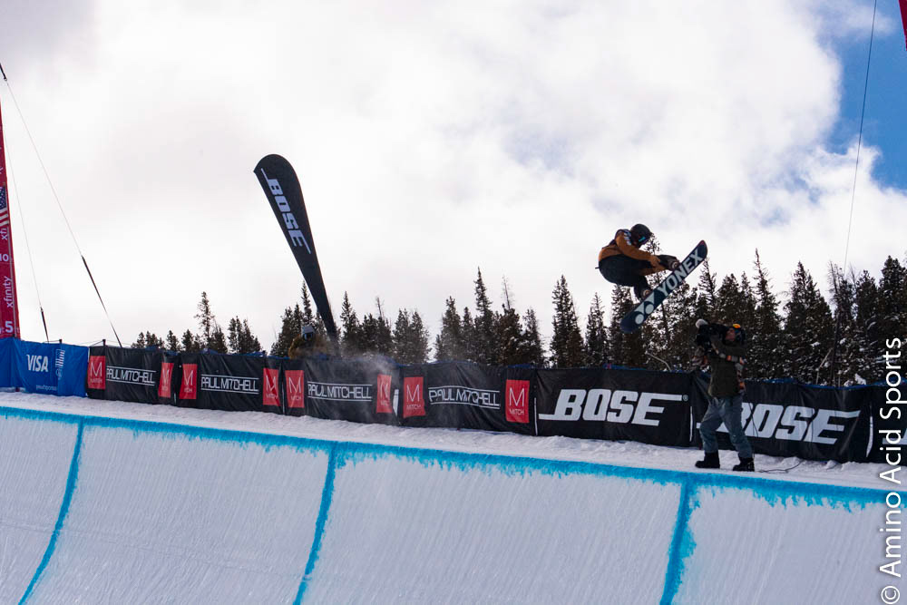 Nippon's Yuto Totsuka soars outta the halfpipe right wall on his spin of his Yonex board
