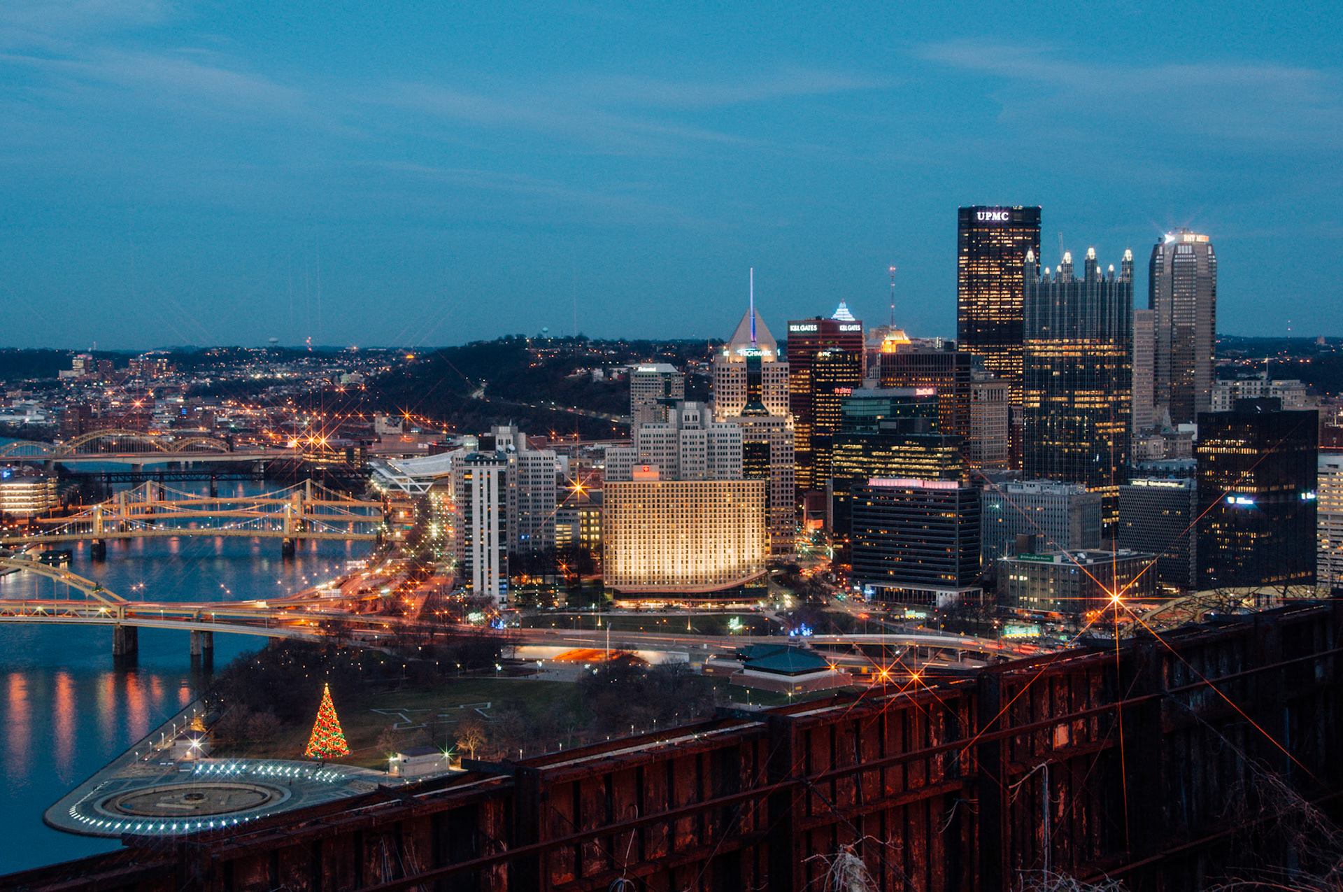 The sun is setting and the City of Pittsburgh is lit for the holidays.