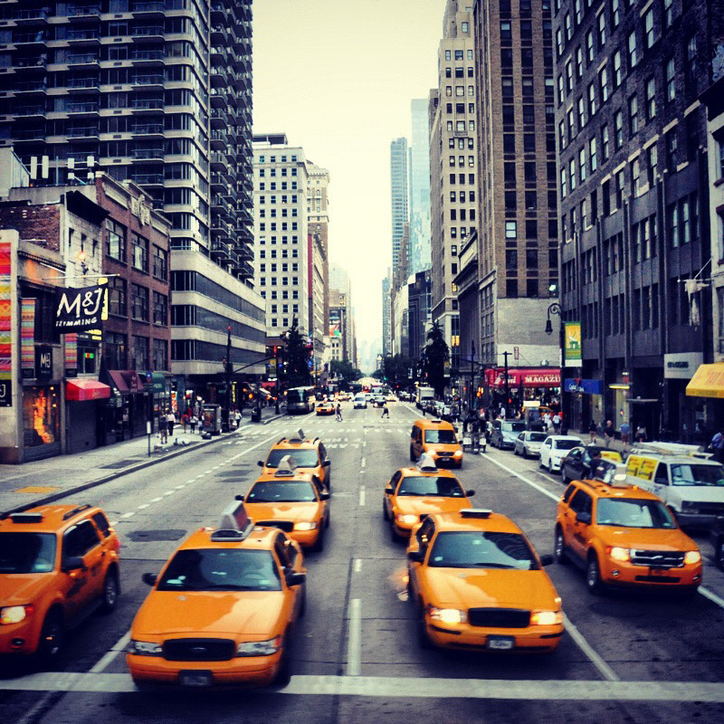 Looking down on taxis at a light on 6th Avenue in New York City.