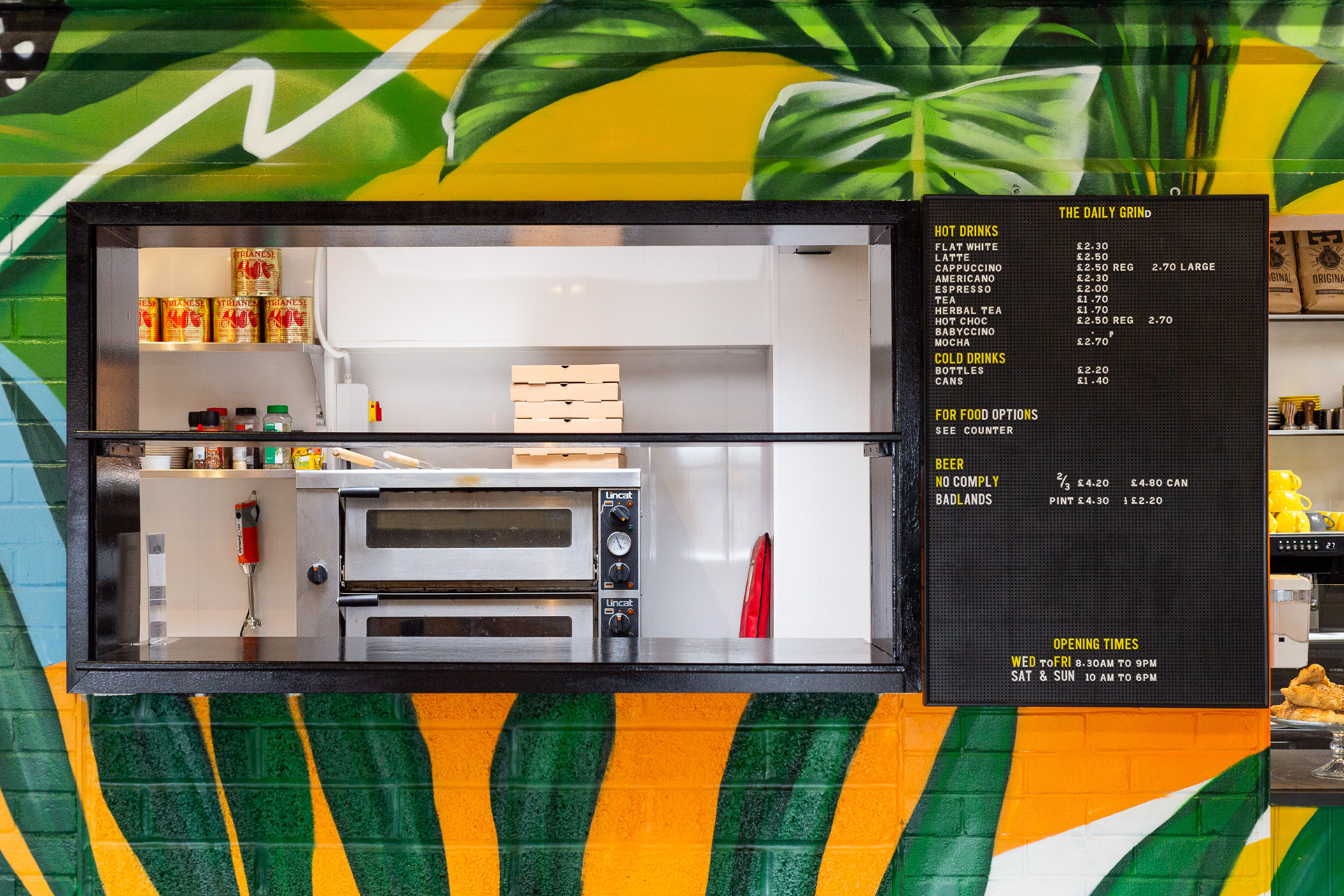 The new food menu at Bristol Campus Pool skate park taken by Jake Hitchcock. The hatch of the bar is surrounded by street art from a local Bristol artist